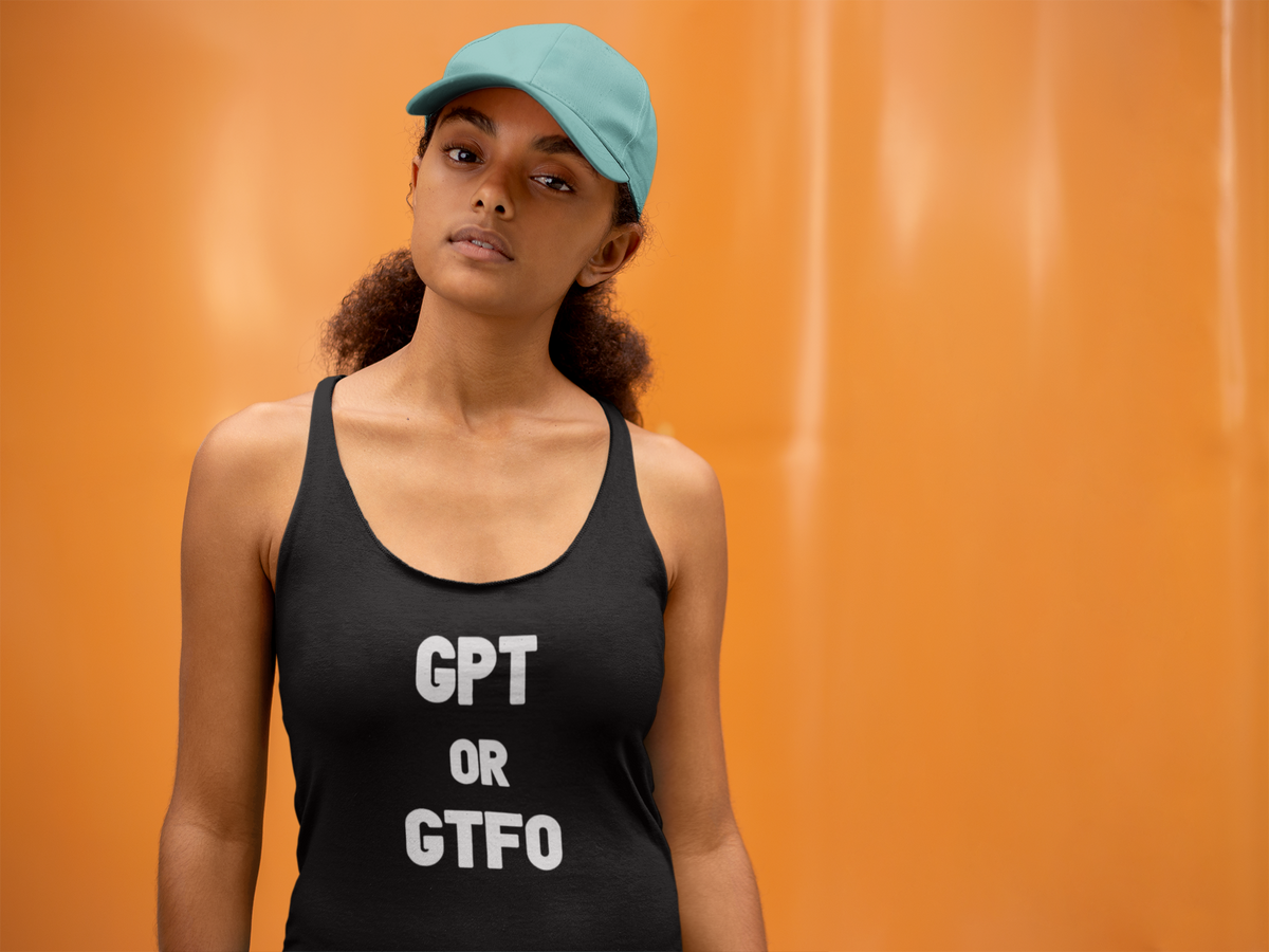 'GPT GTF0 Women's Tank' in black, woman by an orange wall, Tank Top mockup, Geekpsters