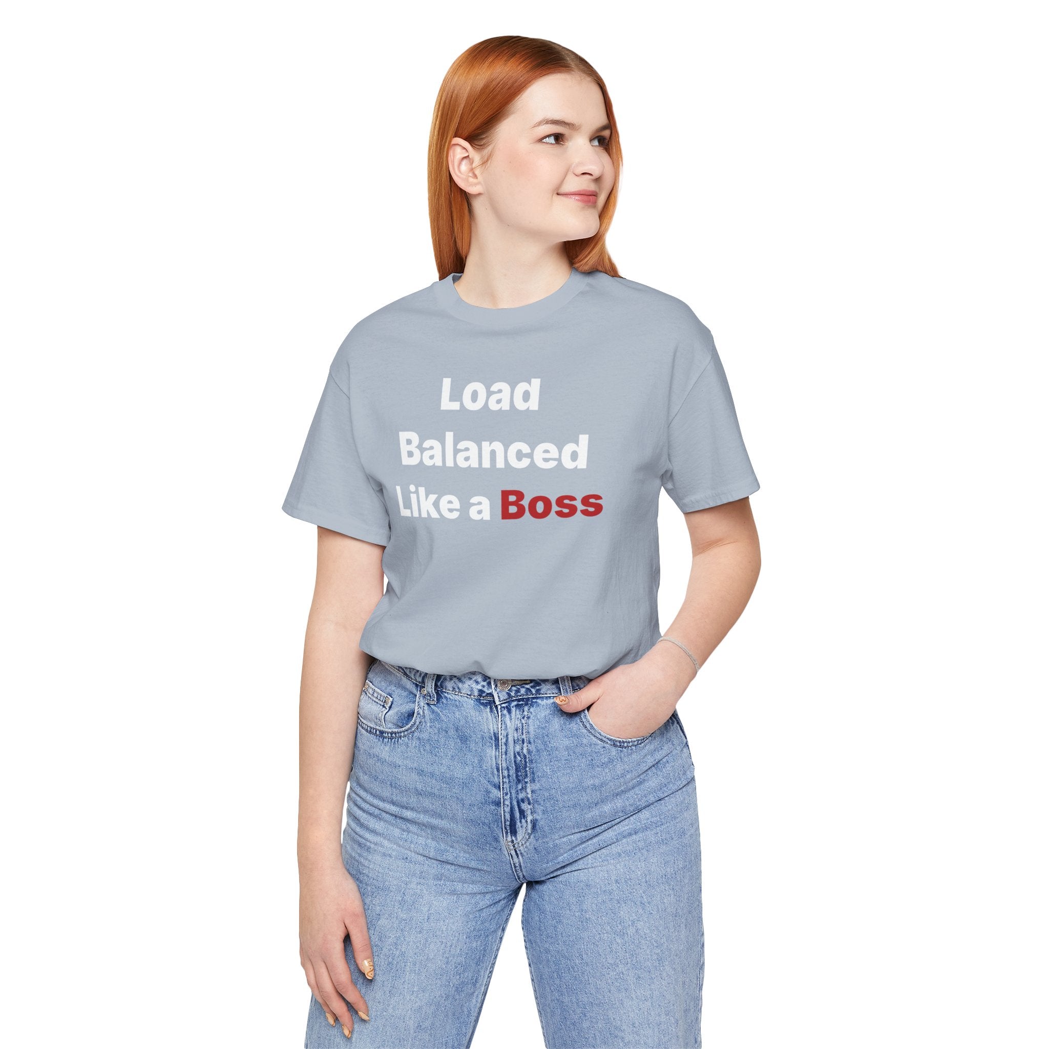 A red-haired person wearing the "Load Balanced Like a Boss" T-shirt made of Airlume cotton, paired with blue jeans.