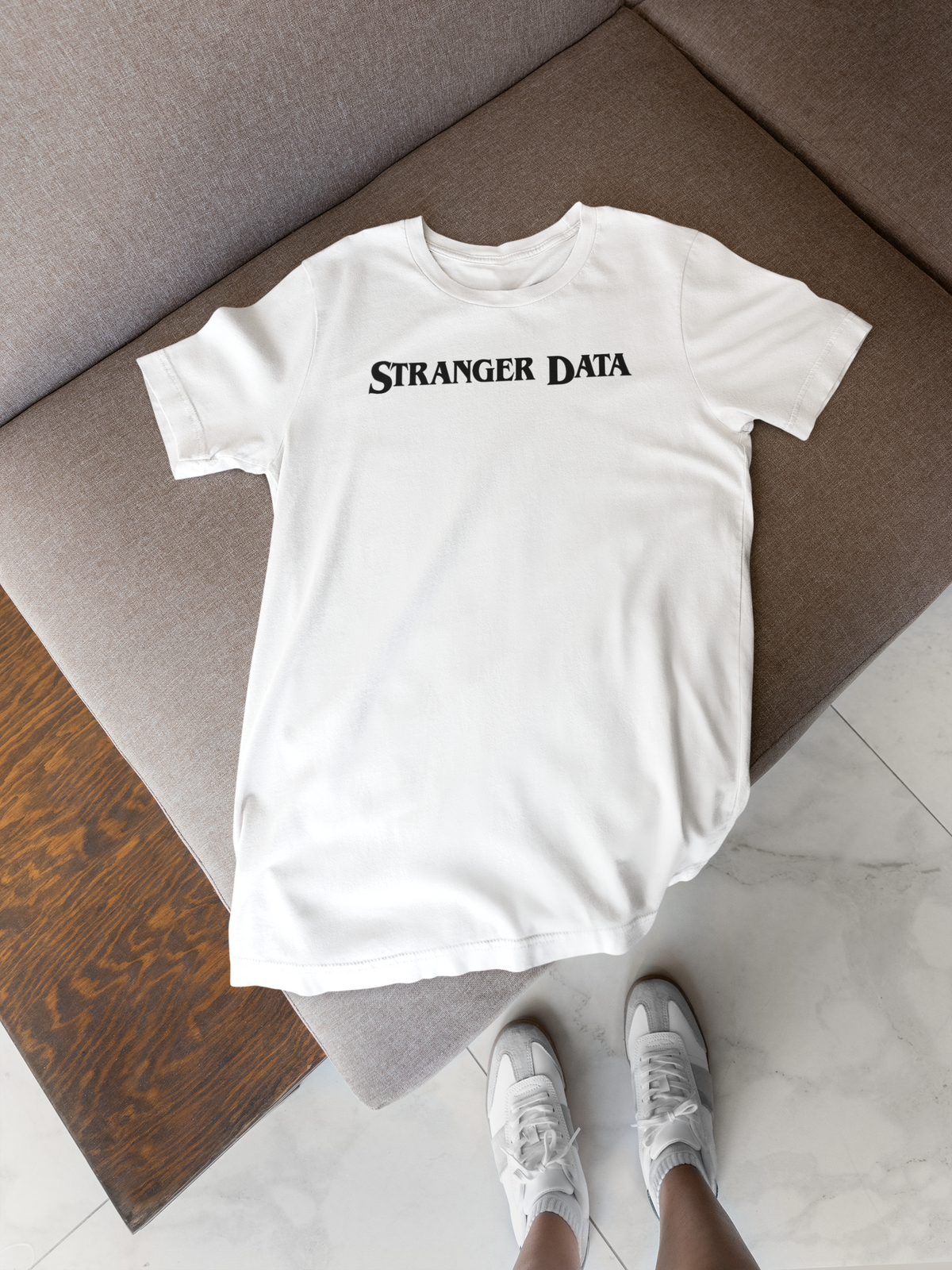 'Stranger Data' T-shirt in white, folded flat lay on a wooden crate, funny developer gift tee