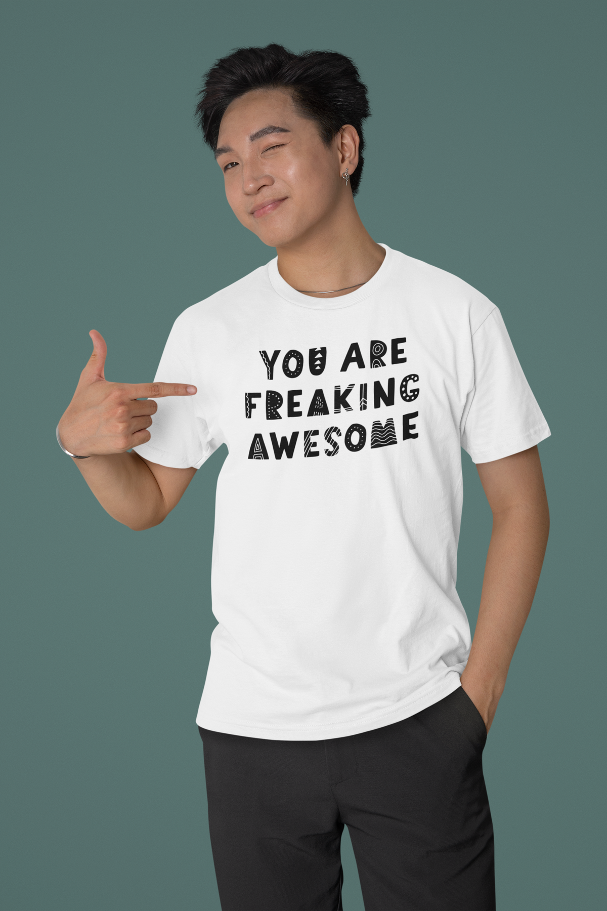 'You're Freaking Awesome' t-shirt in white, smiling man pointing at it