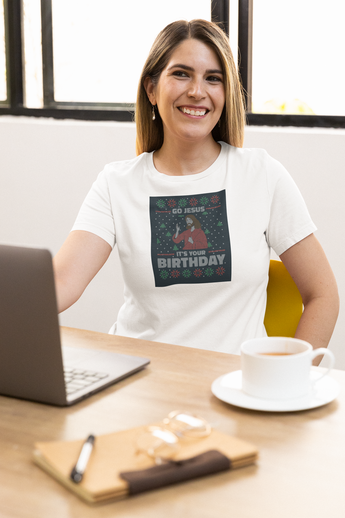 'Go Jesus It's Your Birthday Ugly Sweater T-Shirt' in white, woman at an office desk, T-Shirt mockup, Geekpsters