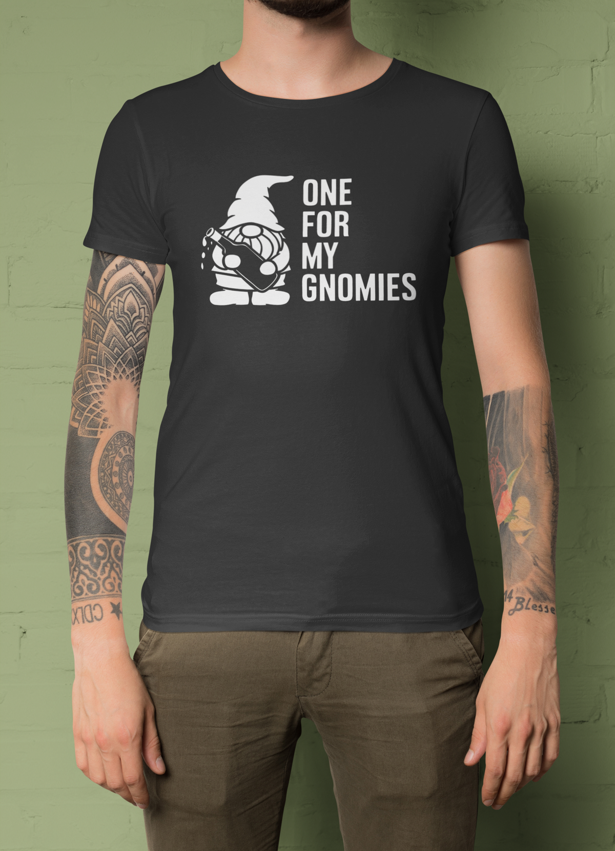 One For My Gnomies t-shirt in black, close up of woman wearing it outdoors, funny gnome pun gift