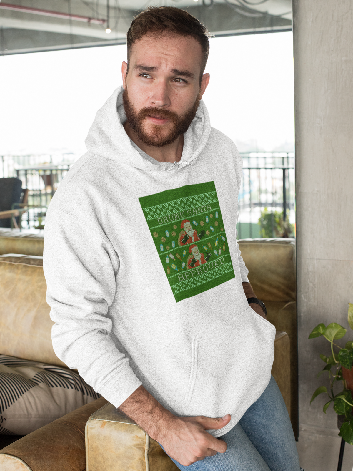 'Drunk Santa Approved' Santa graphic hoodie in white, bearded man wearing it indoors, funny Christmas gift