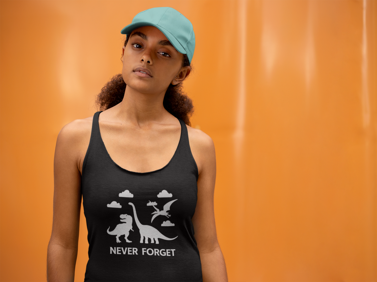 'Never Forget Dinosaur' racerback tank top in black, woman wearing it by an orange wall, Tank Top mockup, Geekpsters