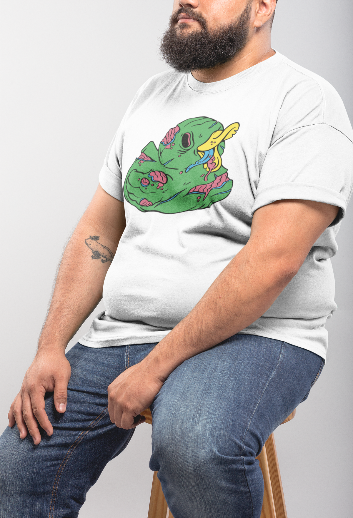 Zombie duck t-shirt in white, heavyset man model seated wearing it, funny spooky season gift