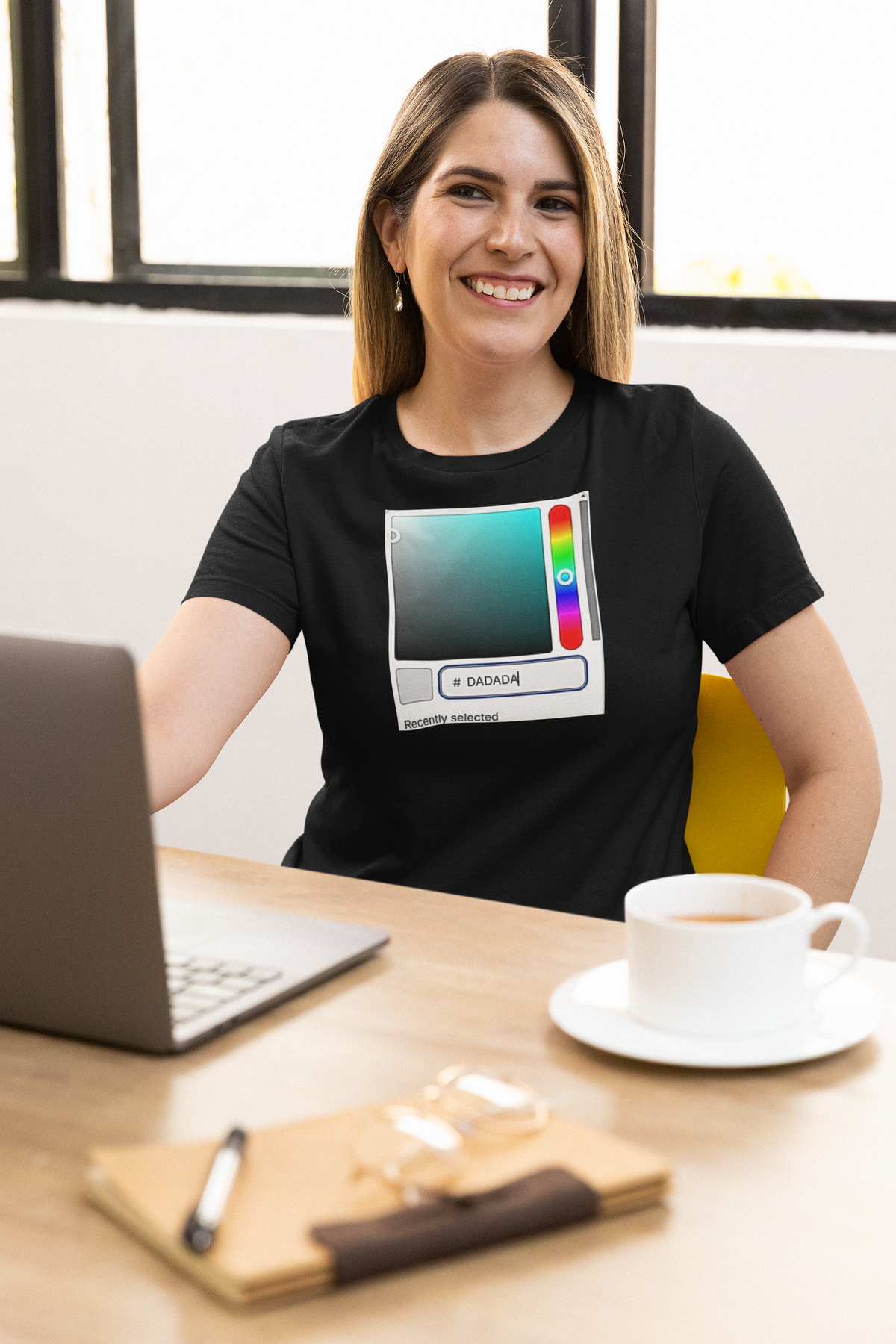 'DADA Paint Organic T-Shirt' in black, woman at an office desk, T-Shirt mockup, Geekpsters