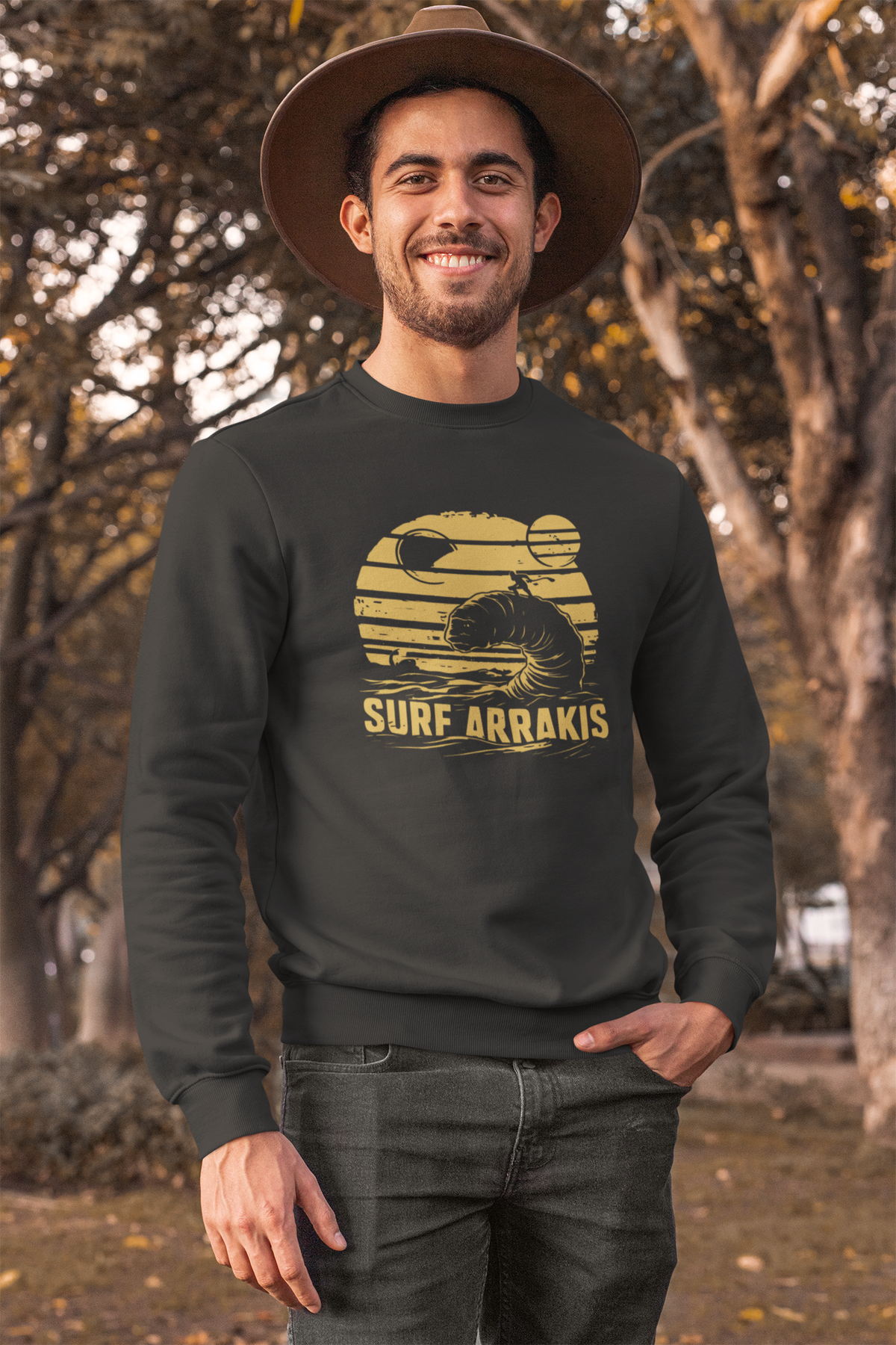 Surf Arrakis sandworm sweatshirt in dark heather, man wearing it outdoors in a park, funny gift