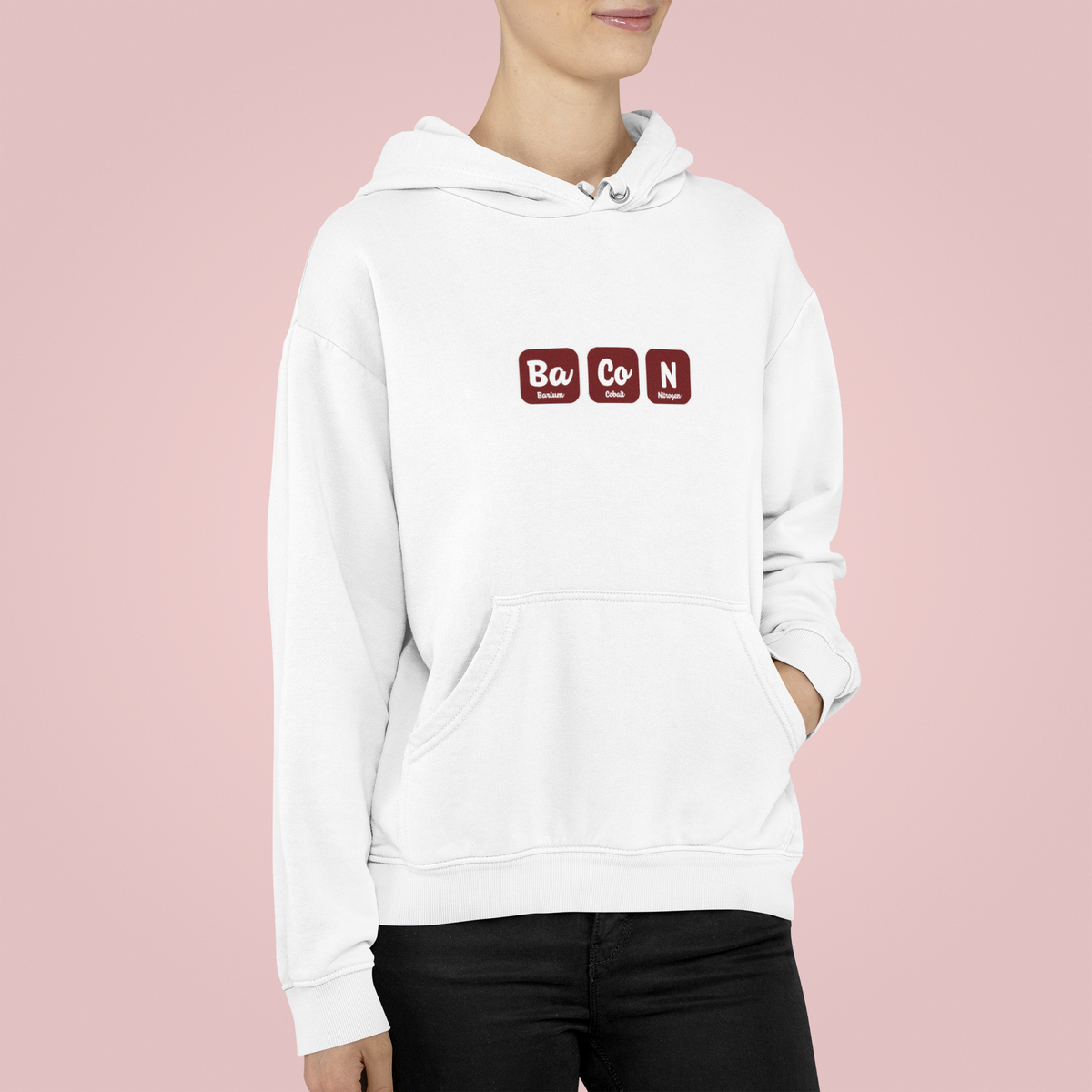 'Ba-Co-N' hoodie in white, woman wearing it against pink backdrop, funny bacon lover gift