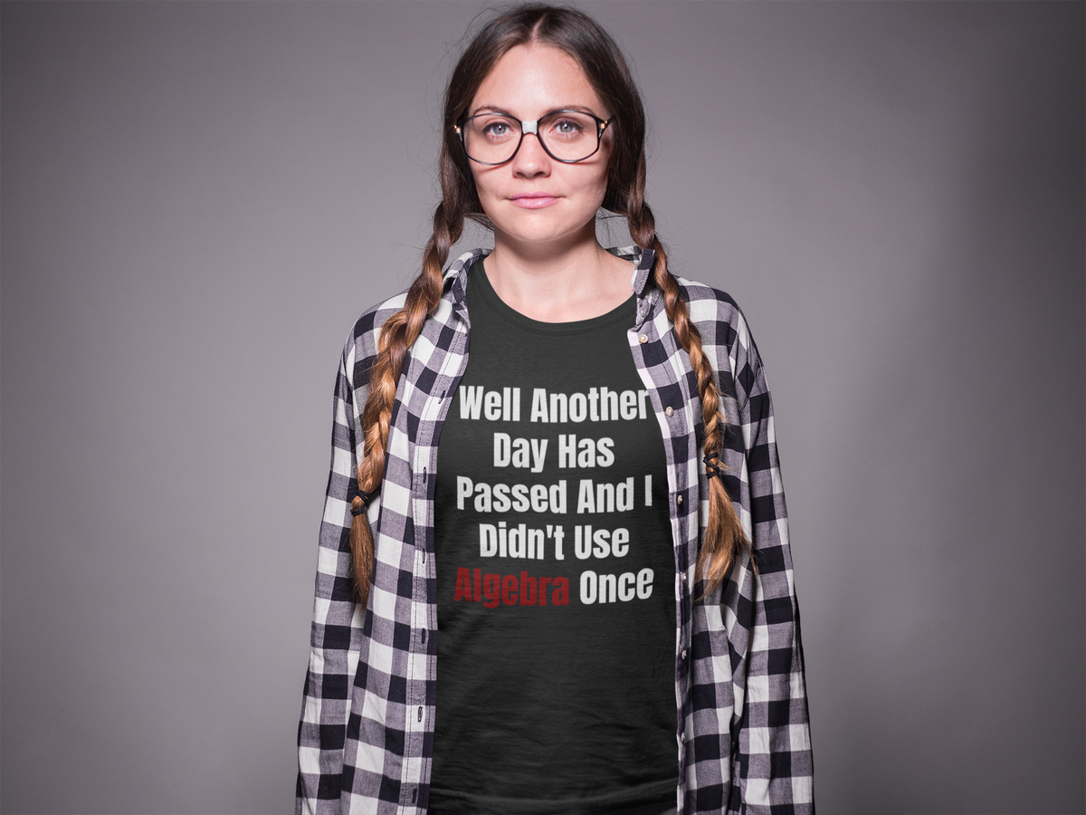 "Well Another Day Has Passed And I Didn't Use Algebra Once" t-shirt in black, woman in plaid overshirt