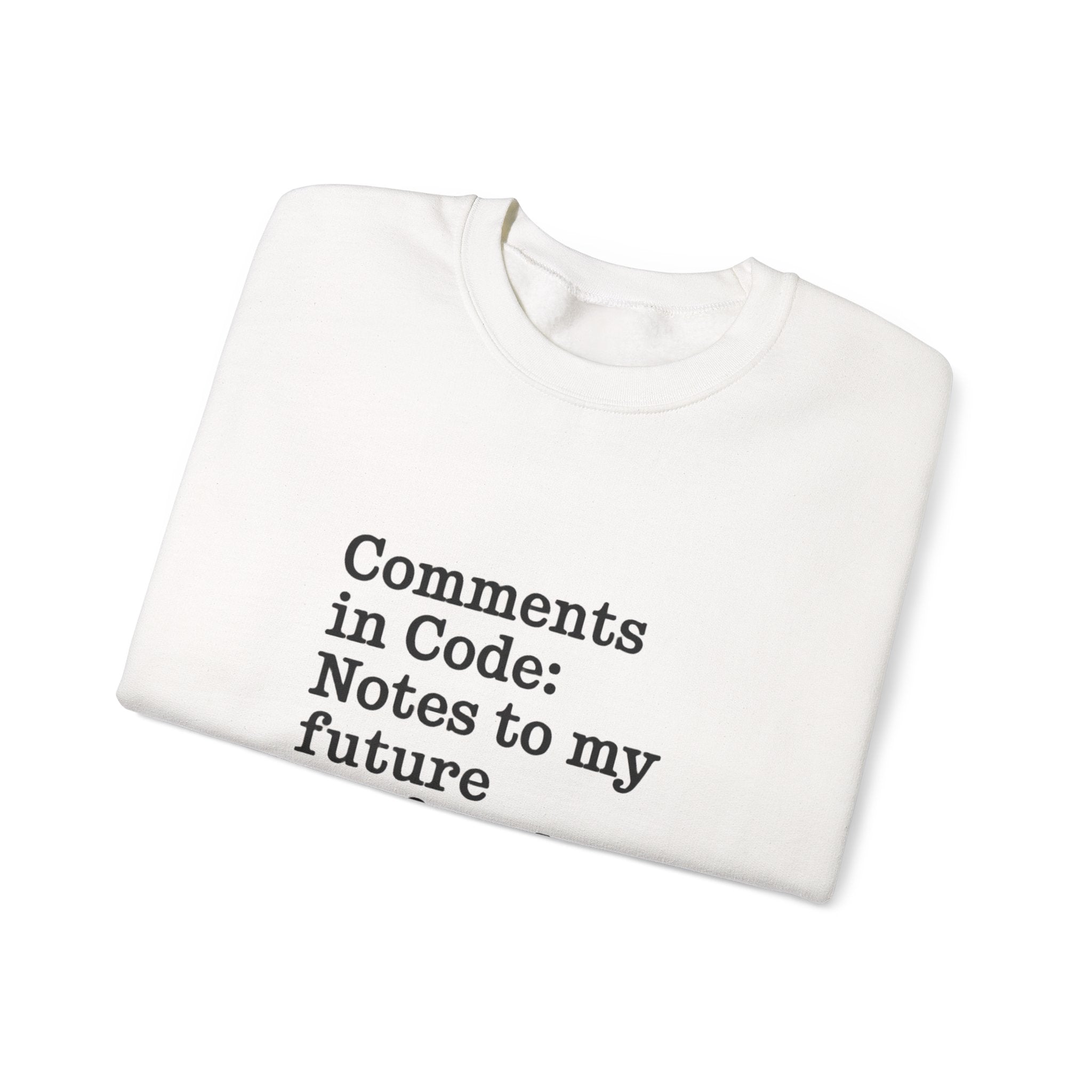 The "Comments in code - Sweatshirt" is a folded, cozy sweatshirt made from sustainable cotton with "Comments in Code: Notes to my future" in black on the front. Custom embroidery options available.