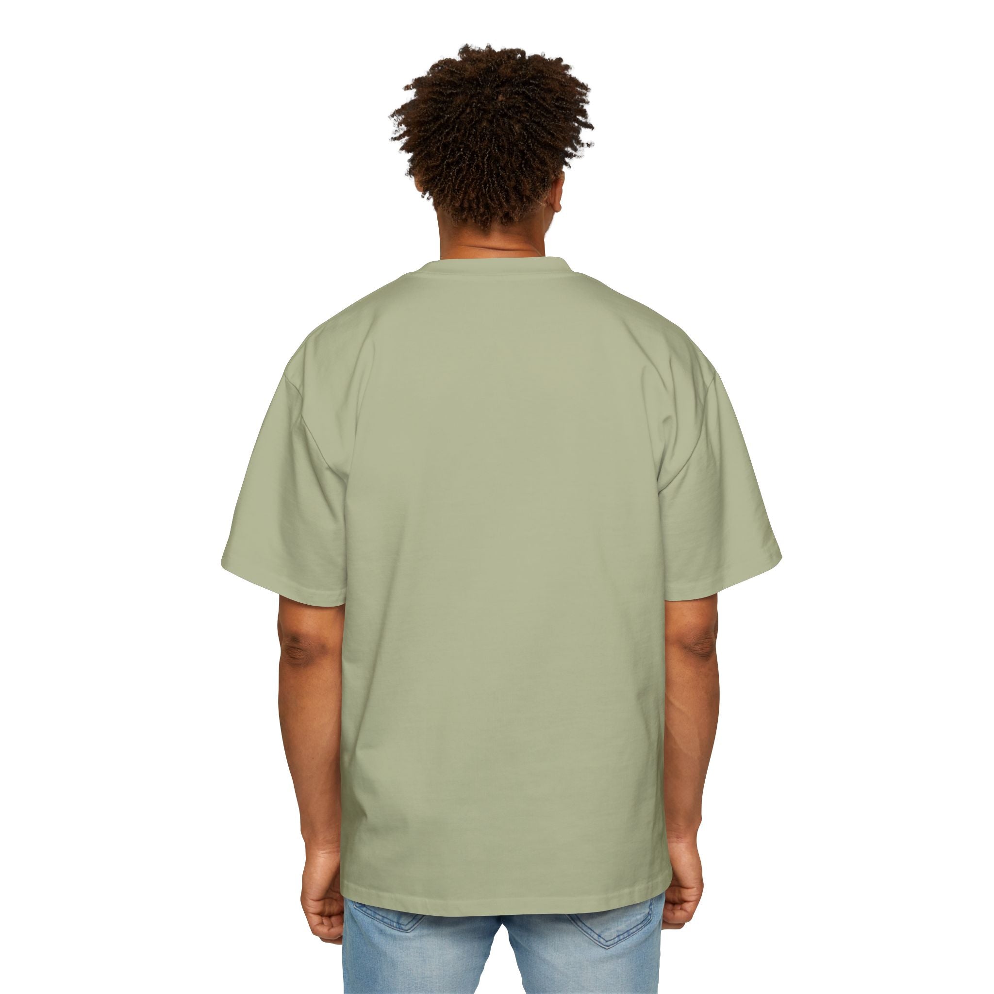 A person stands facing away, wearing the I Don't Always Optimize Queries - Heavy Oversized Tee in light green and light blue jeans against a white background.