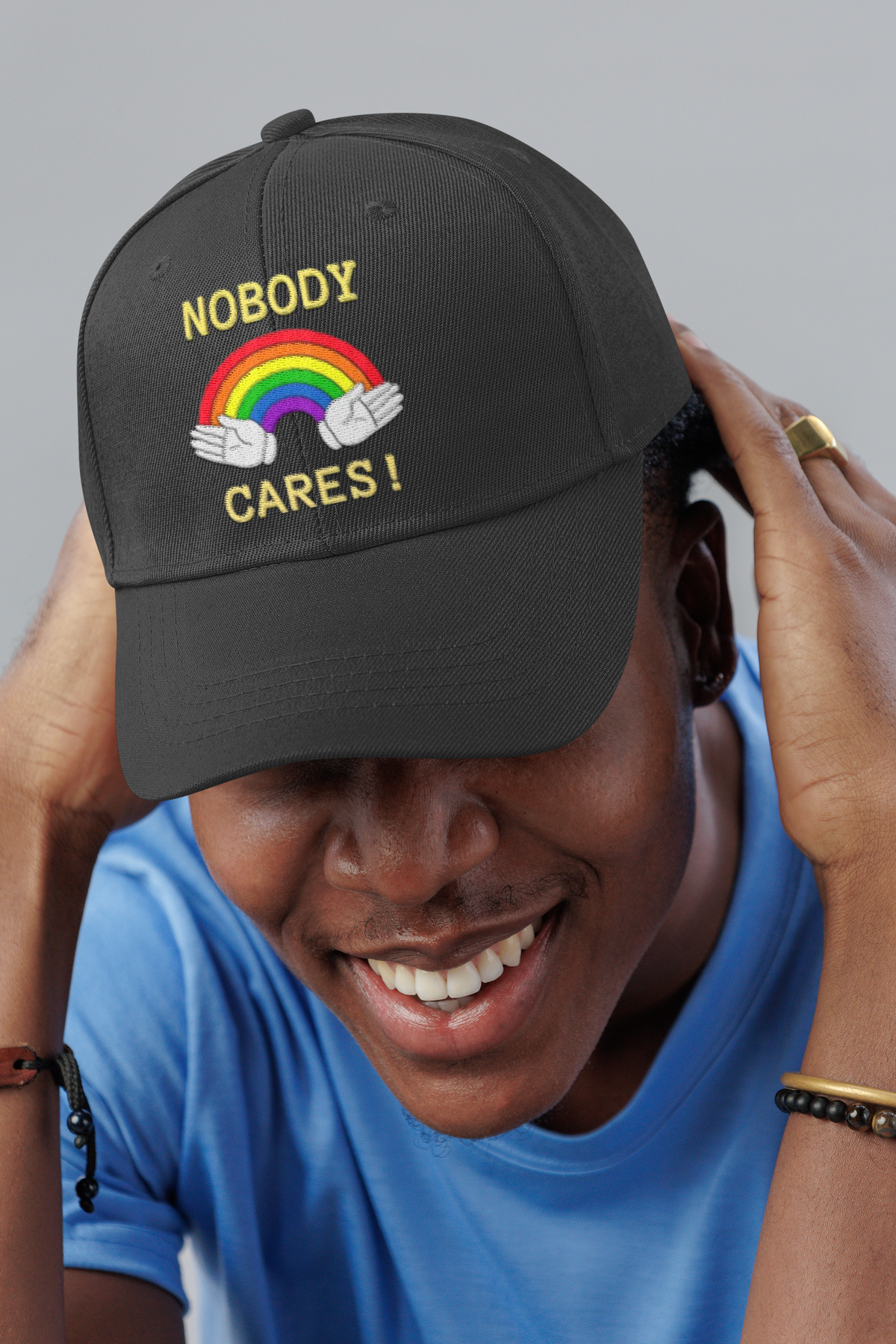 Nobody Cares sarcastic dad hat, smiling man in a studio, lifestyle mockup, Geekpsters