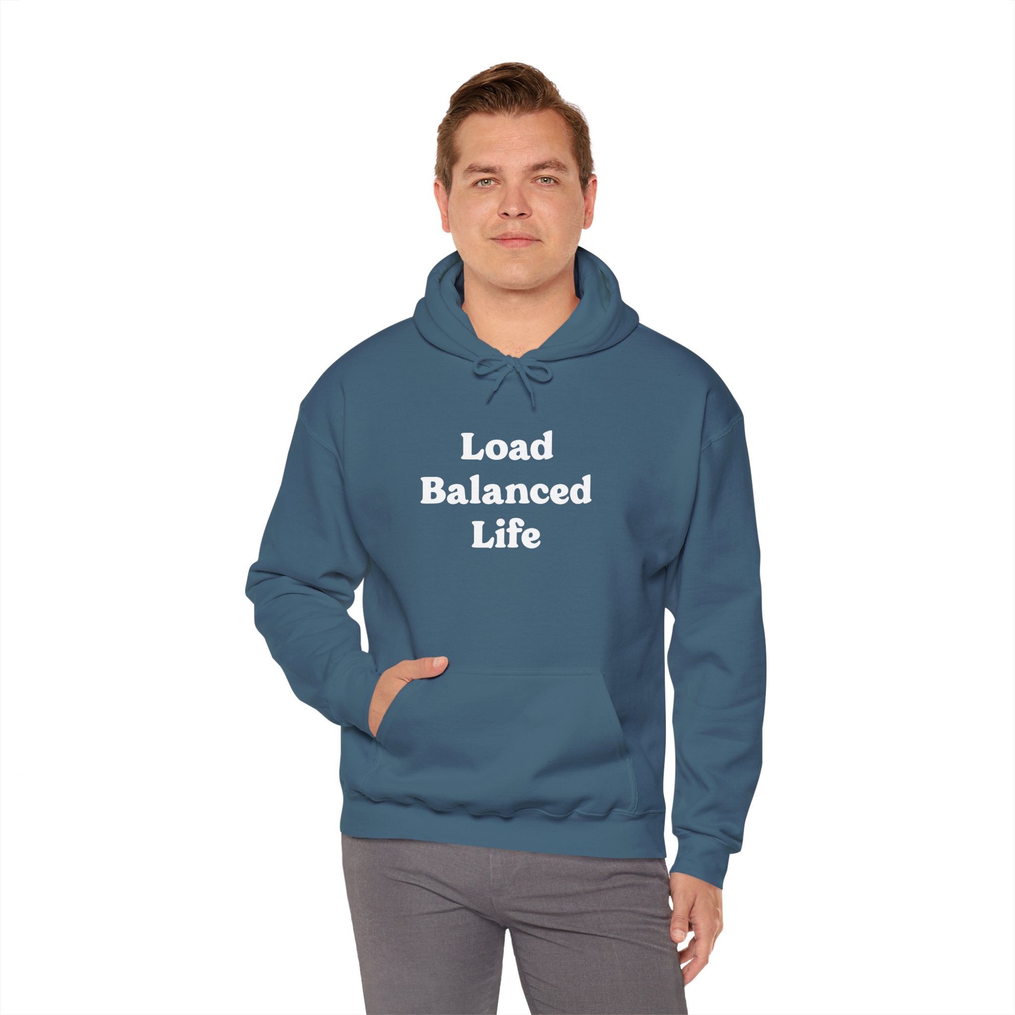 A person stands against a plain background wearing the Load Balanced Life - Hooded Sweatshirt in blue, which provides seamless comfort and perfectly embodies the concept of balance and ease.