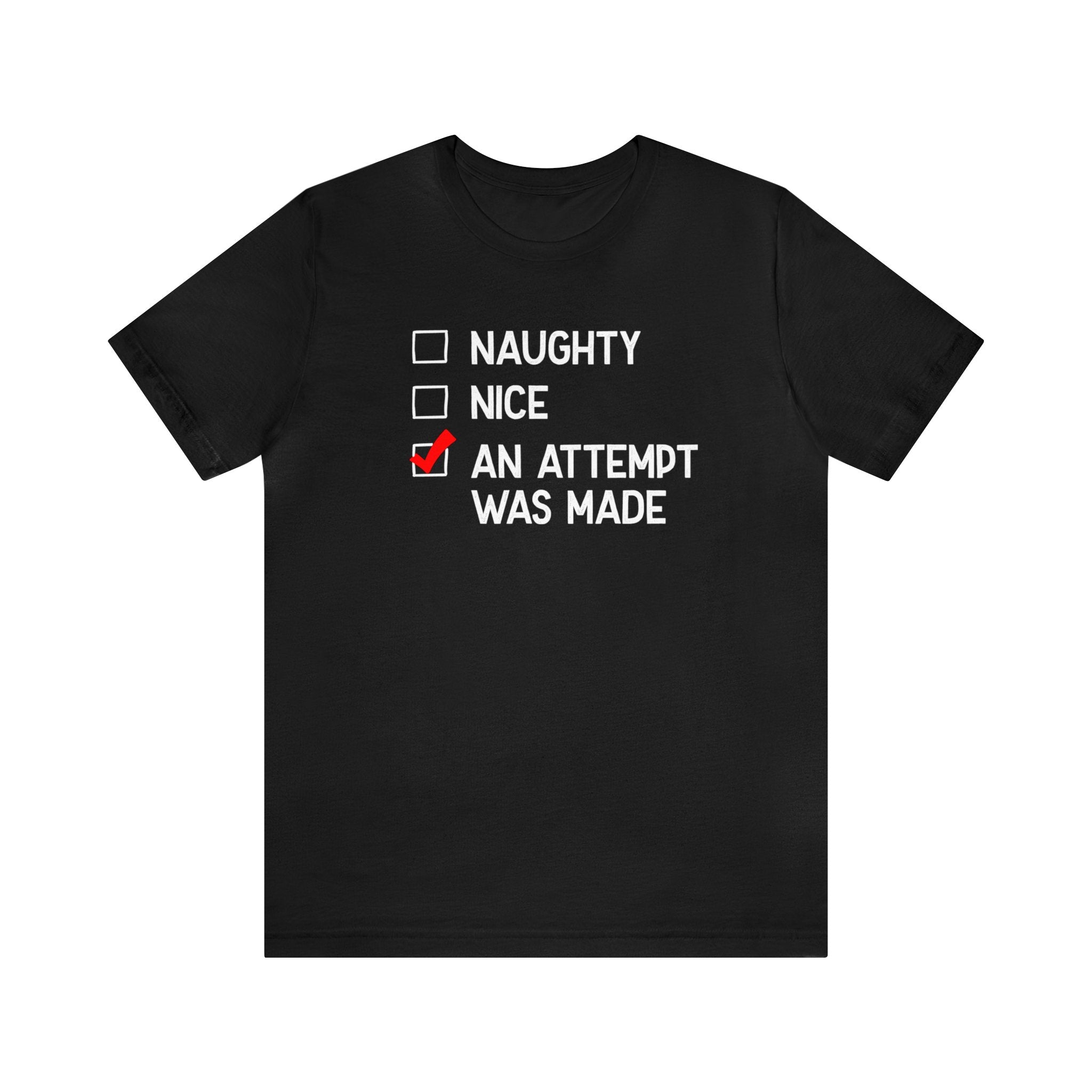 Black T-shirt featuring three checkboxes labeled "Naughty," "Nice," and "An Attempt Was Made." The third box is checked with a striking red mark, creating a bold statement. This Naughty, Nice T-Shirt is essential for those who value humor and honesty in their wardrobe.