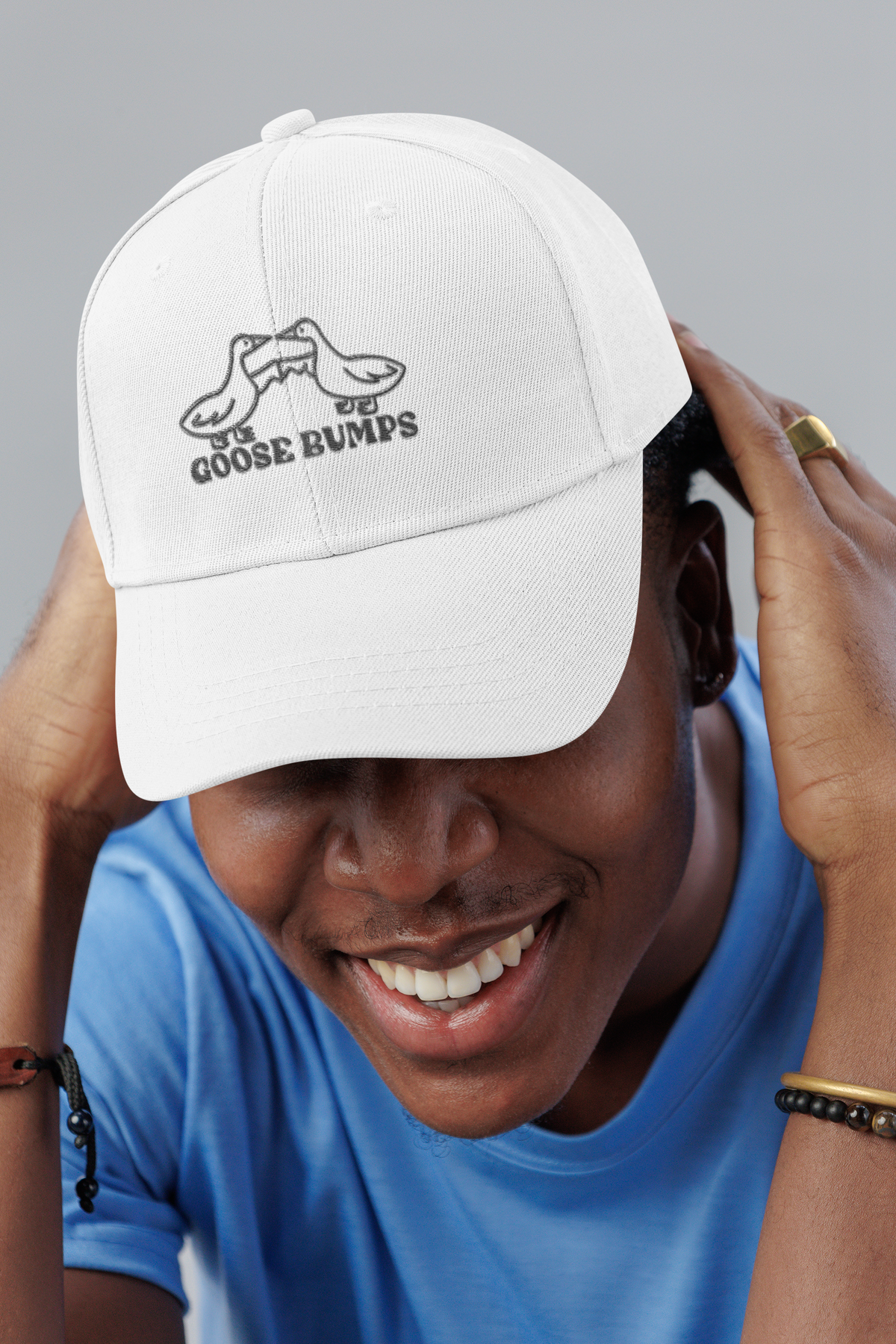Goose Bumps pun dad hat, smiling man in a studio, lifestyle mockup, Geekpsters