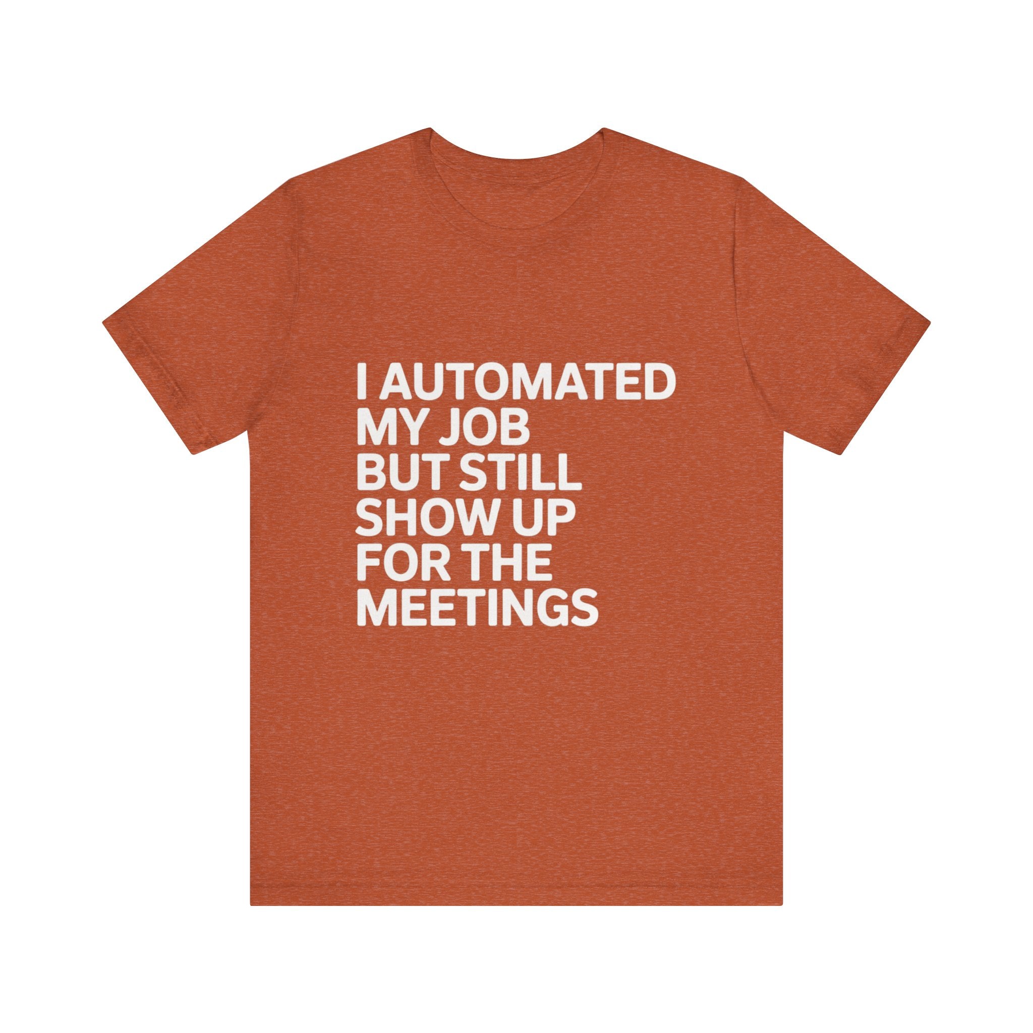 A rust-colored "I Automated My Job But Still Show Up for the Meetings" programmer t-shirt featuring white text and a humorous design.