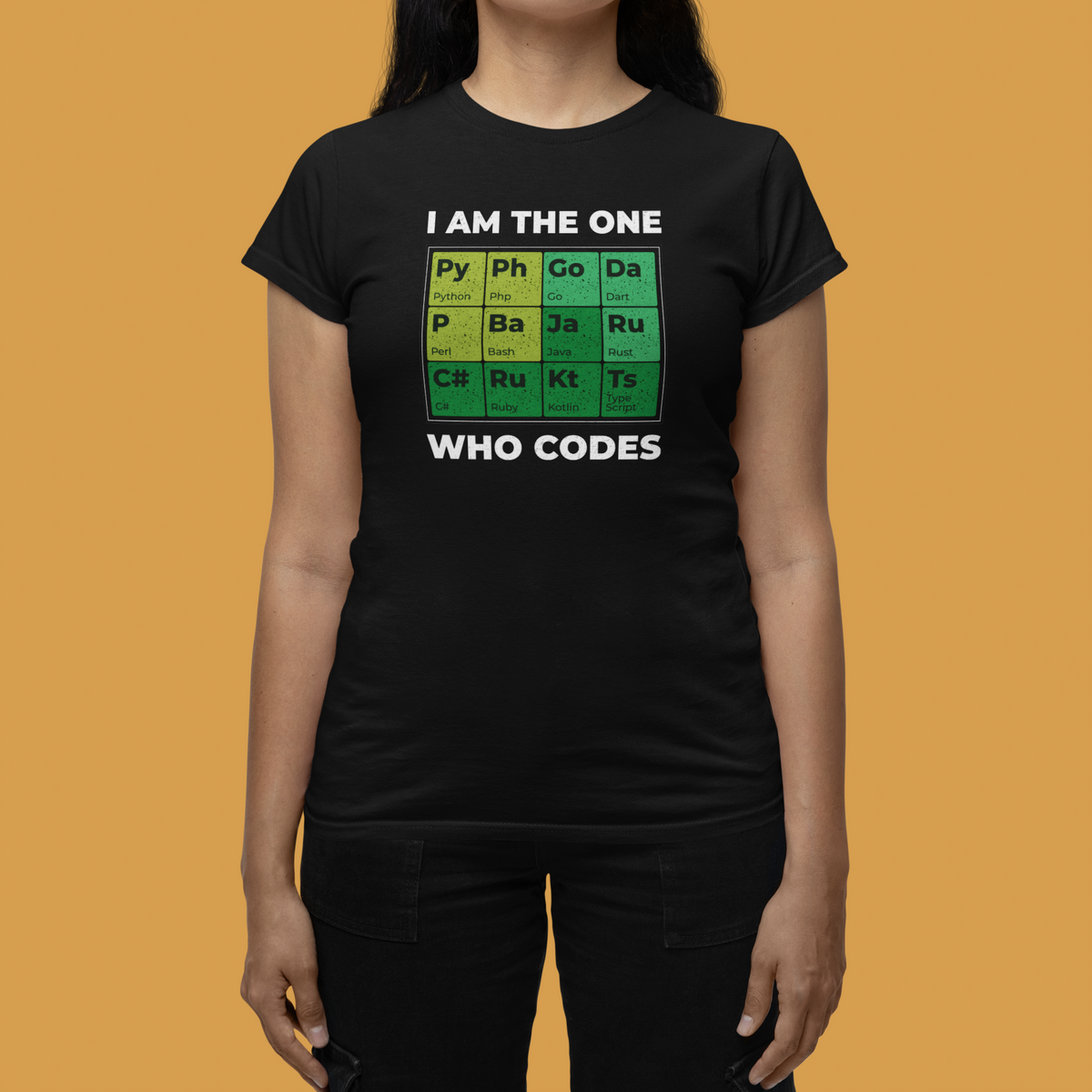 'I Am the One Who Codes' periodic table t-shirt in black, woman on mustard background, funny developer tee