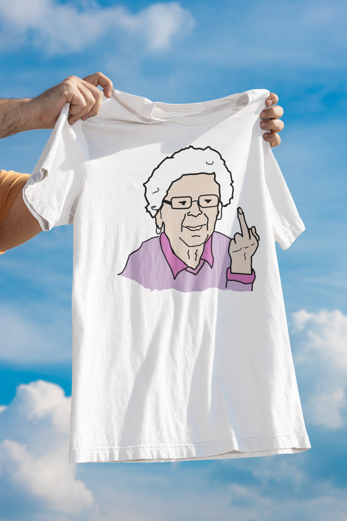 Granny middle finger t-shirt in white, held up outdoors against a blue sky, funny sarcastic humor shirt