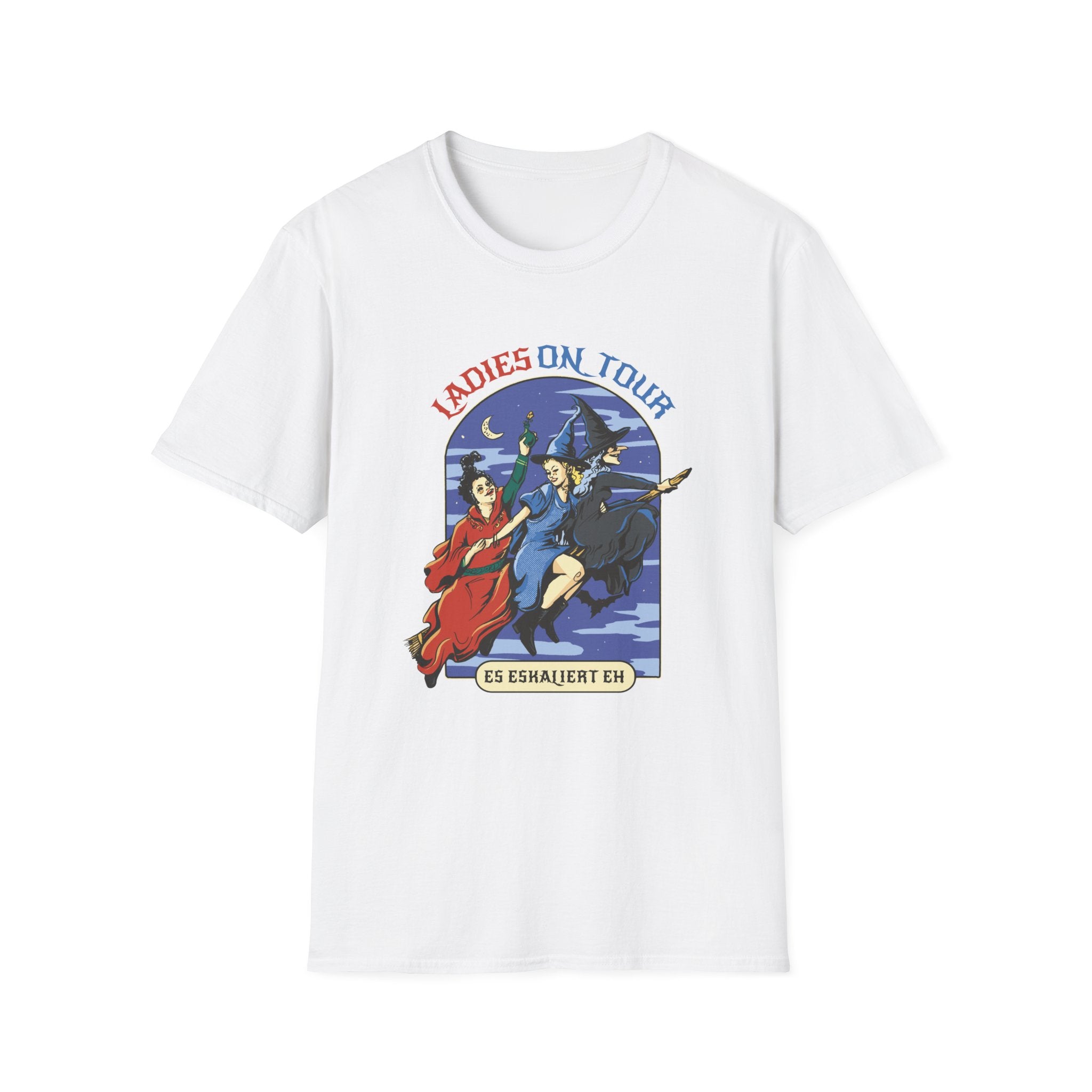 The Ladies On Tour T-Shirt is a white tee with a graphic of two witches flying under a moonlit sky, featuring the text "Ladies On Tour" and "Es Eskaliert Eh," perfect for pop culture fans who enjoy whimsical designs.