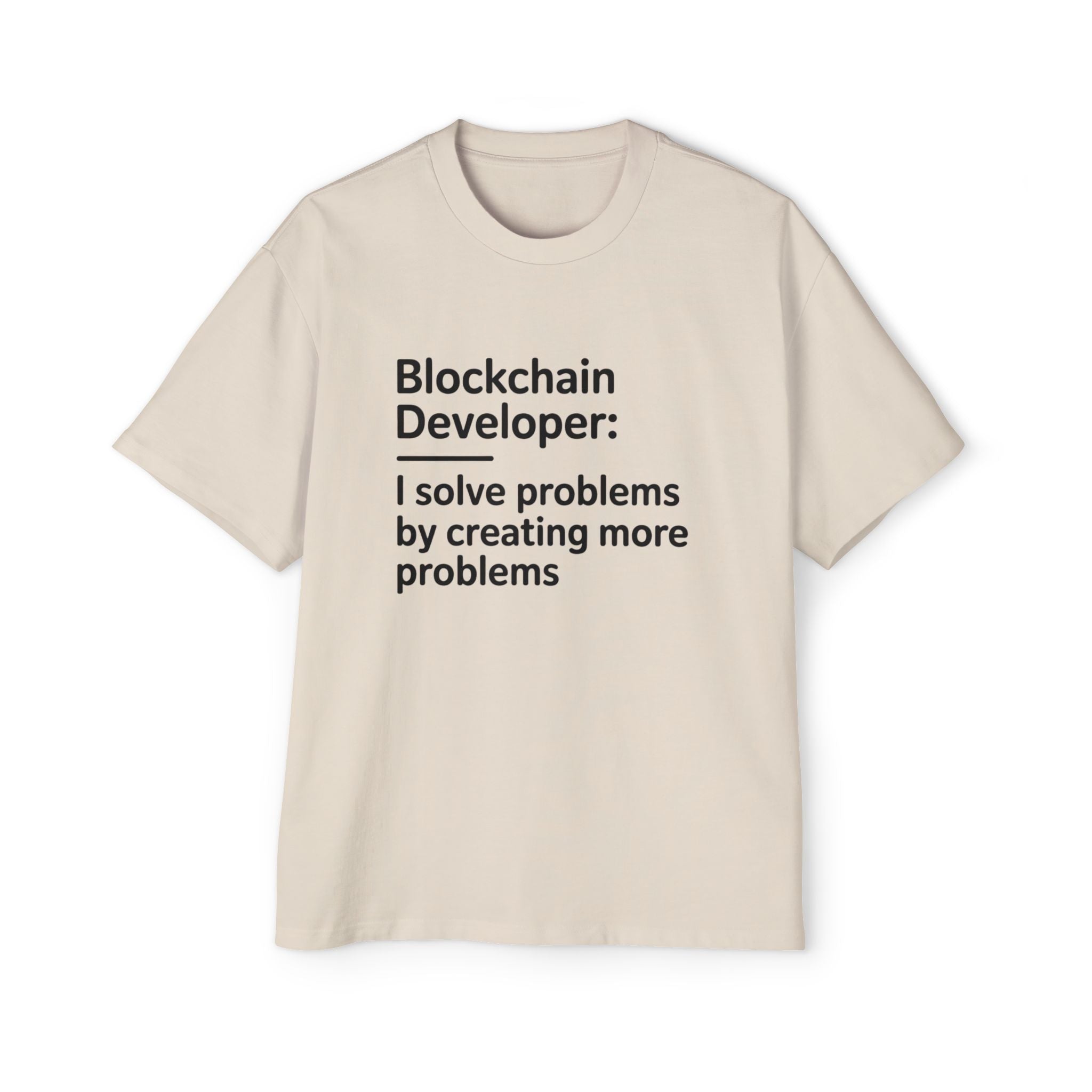 The Blockchain Developer Heavy Oversized Tee is a beige 100% cotton shirt with bold black text: "Blockchain Developer: I solve problems by creating more problems." Perfect for tech lovers who appreciate comfort and humor.