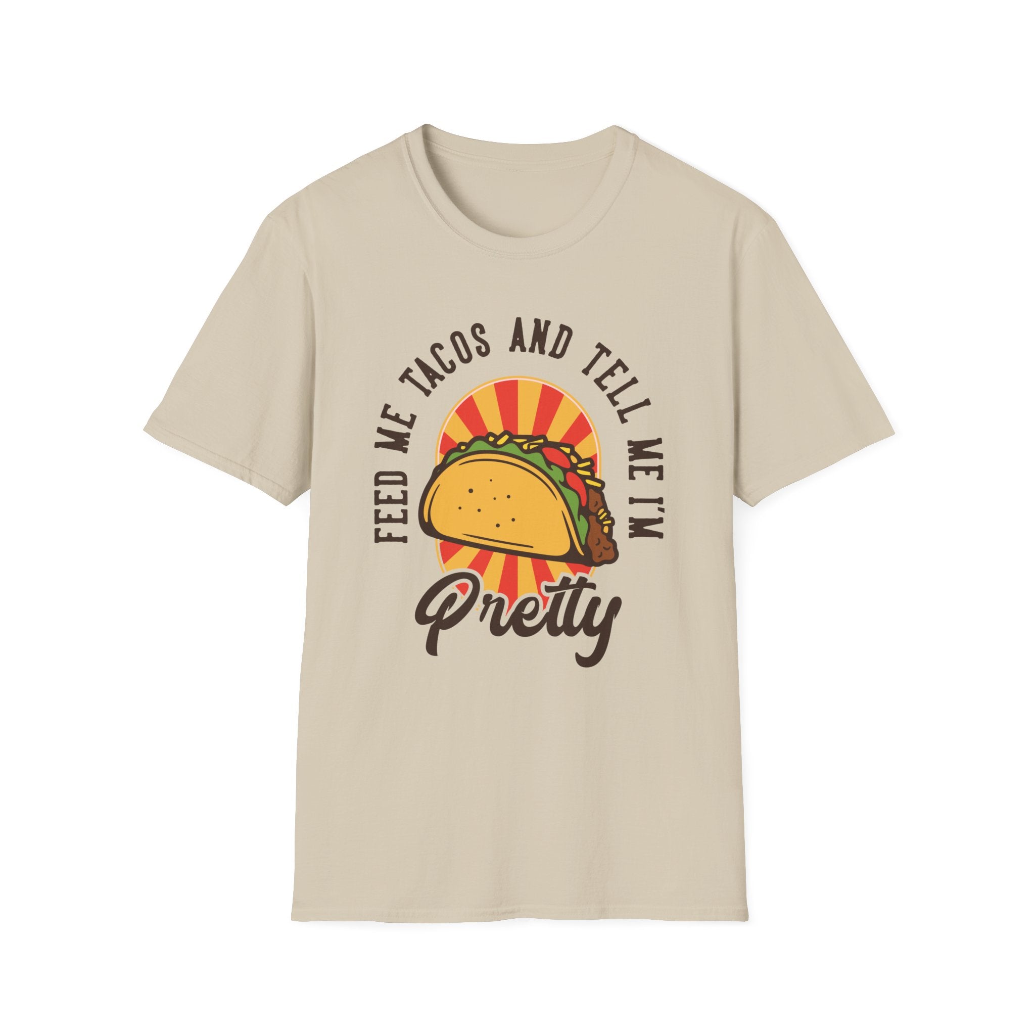 This beige T-shirt, named "Feed Me Tacos and Tell Me I'm Pretty," is perfect for taco lovers. Featuring a playful image and cheeky text, it's an ideal choice for those who celebrate Taco Tuesdays in style.