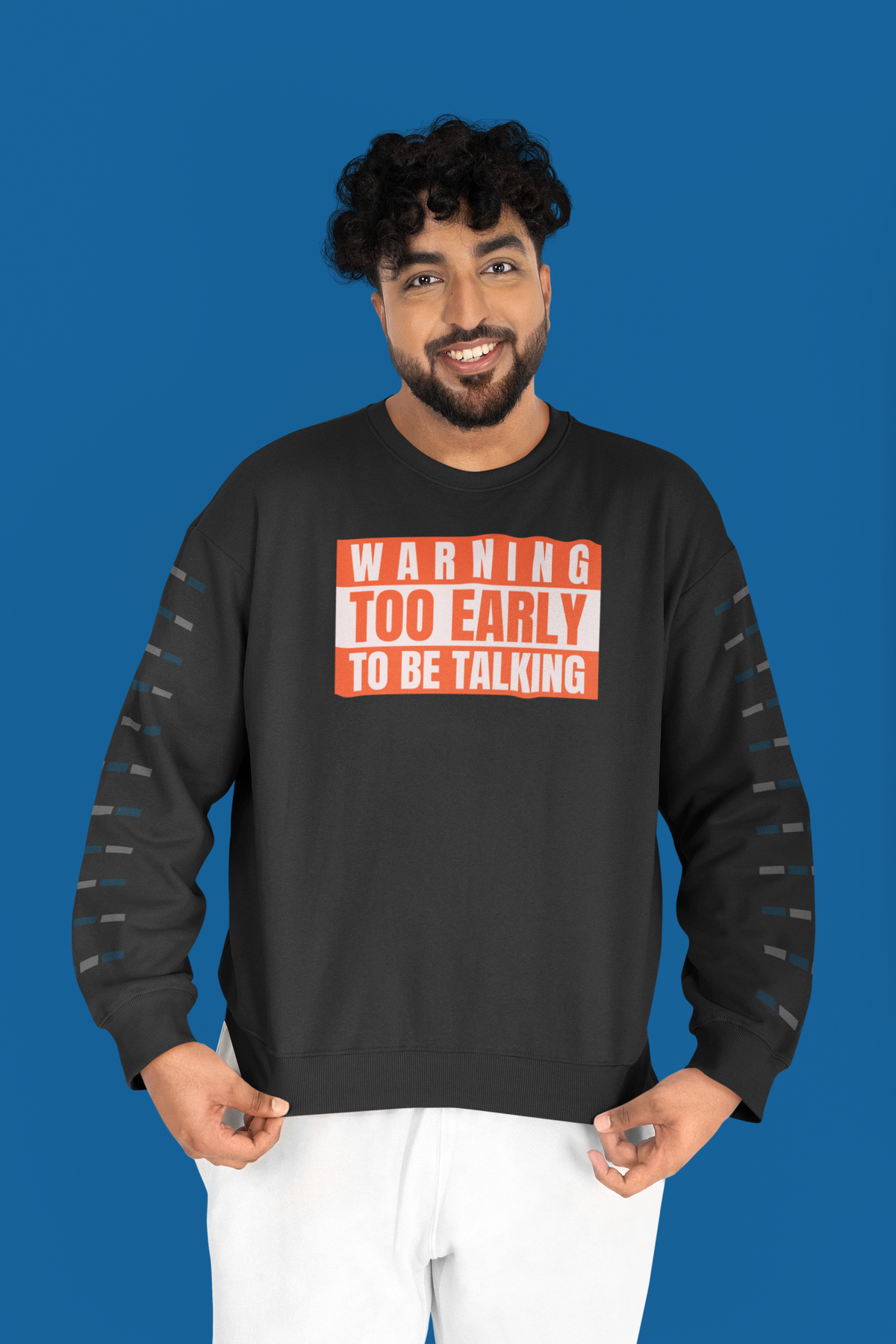 'Warning Too Early To Be Talking' sweatshirt in black, man wearing it blue background, funny sarcastic gift