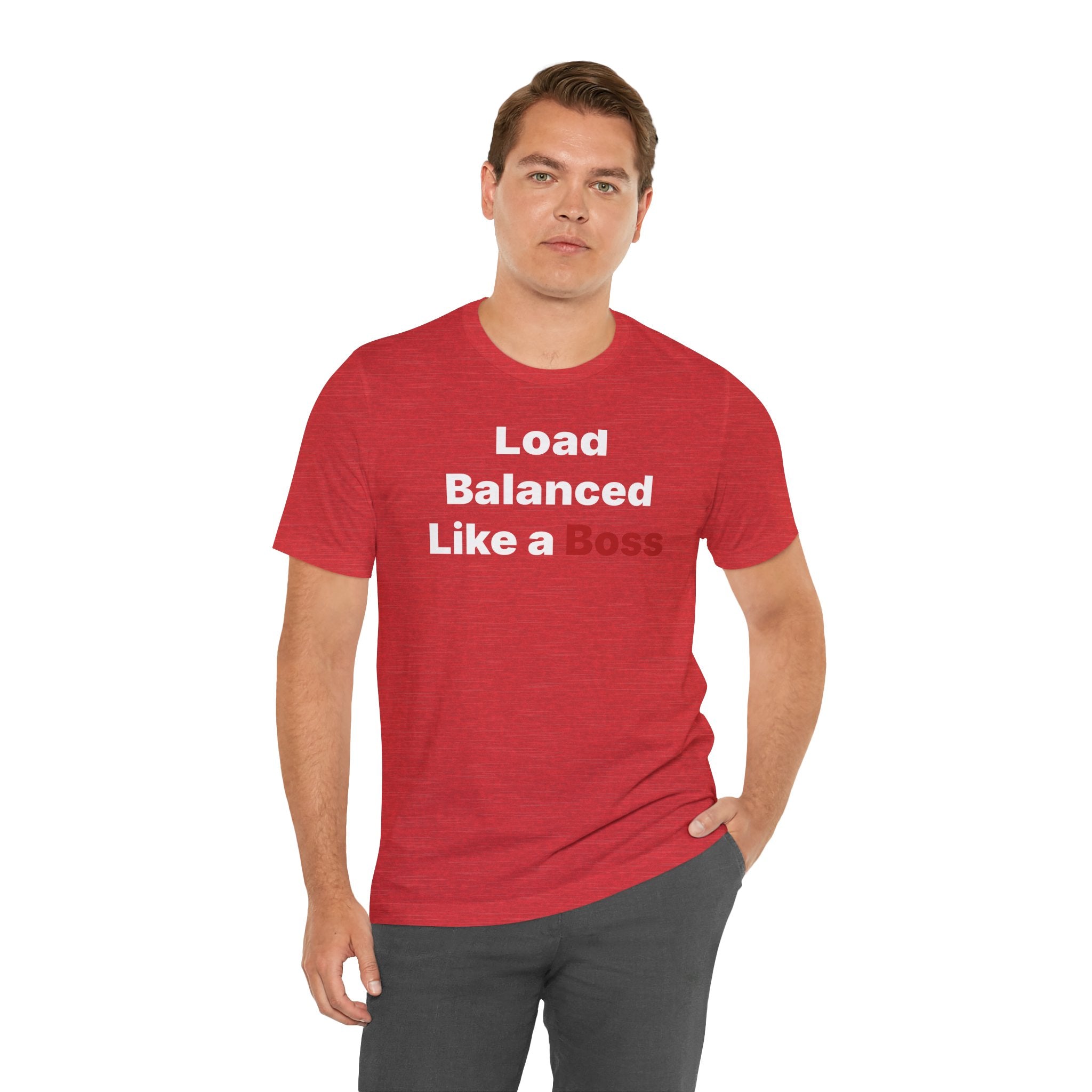 Wearing the "Load Balanced Like a Boss" T-shirt, a person confidently poses against a simple white backdrop. The red tee, made from soft Airlume cotton, features the bold "Load Balanced Like a Boss" statement in striking white and black letters.