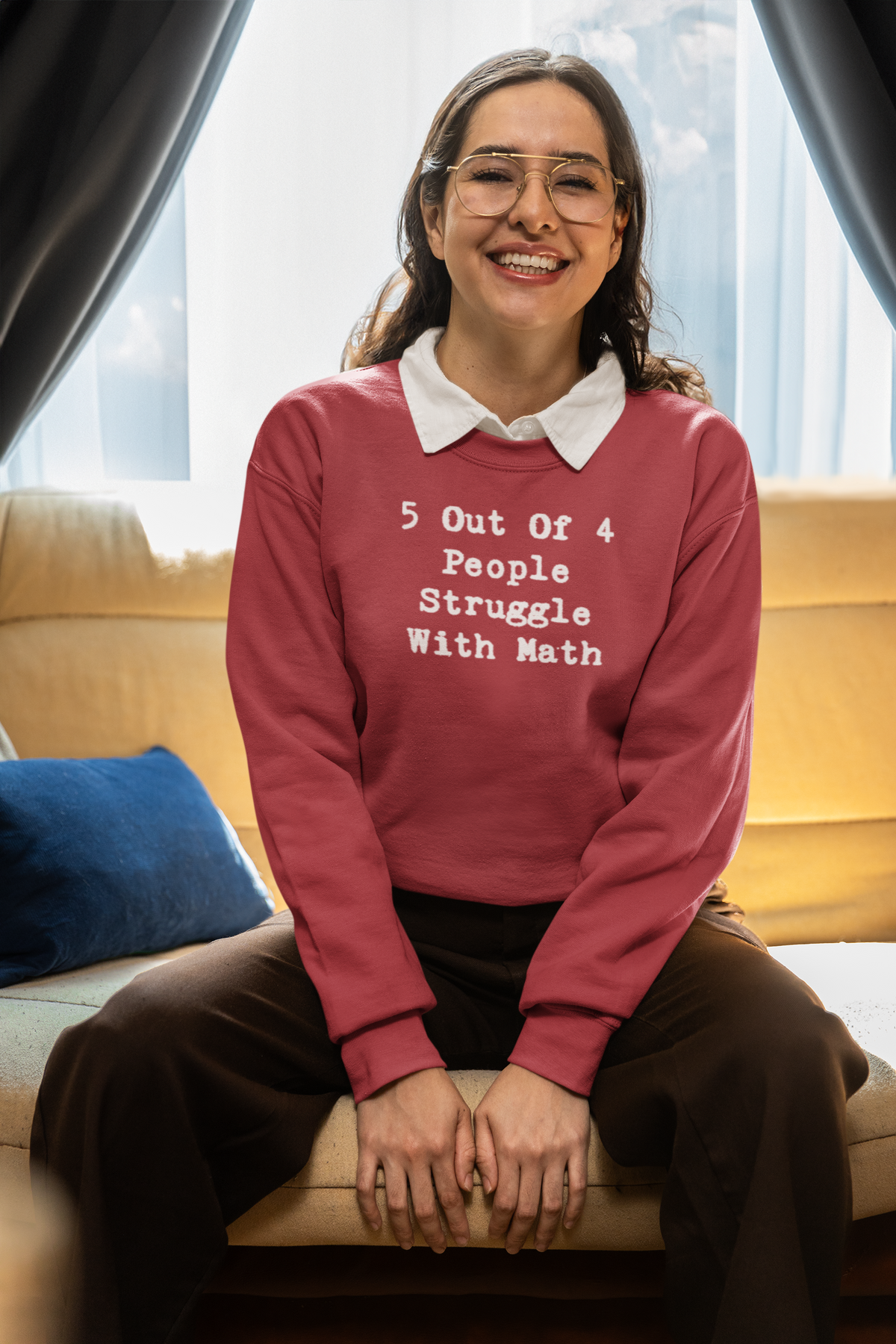 'Math Struggle For 5 Out Of 4 People Sweatshirt' in heather sport scarlet red, smiling woman indoors, Sweatshirt mockup
