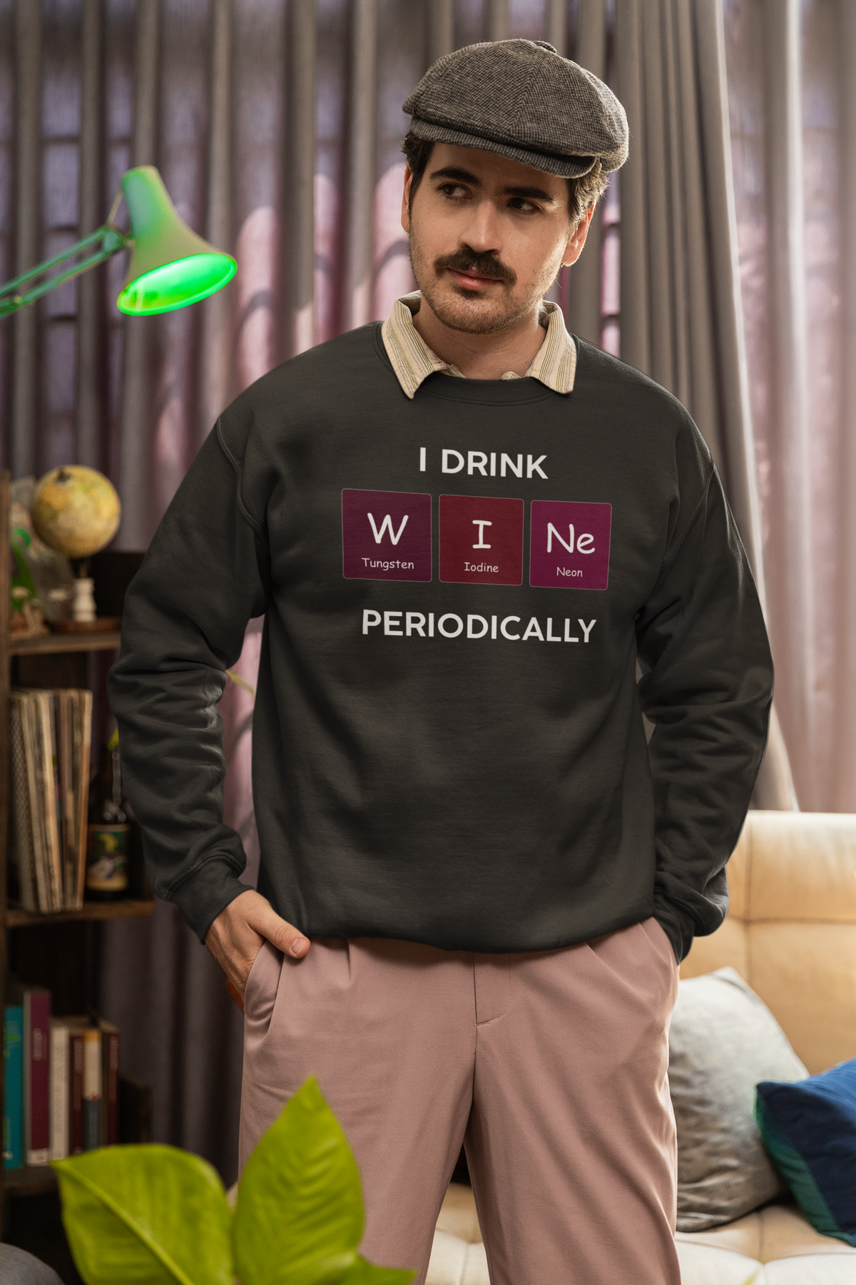 'I Drink Wine Periodically' periodic table sweatshirt in black, bearded man wearing it at home, funny wine pun gift