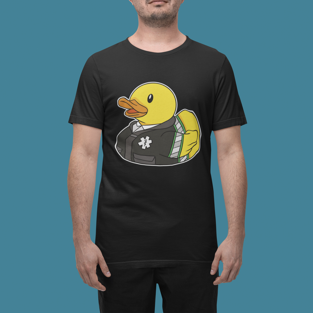 Medical worker duck t-shirt in black, man model wearing it against a teal background, funny nurse gift