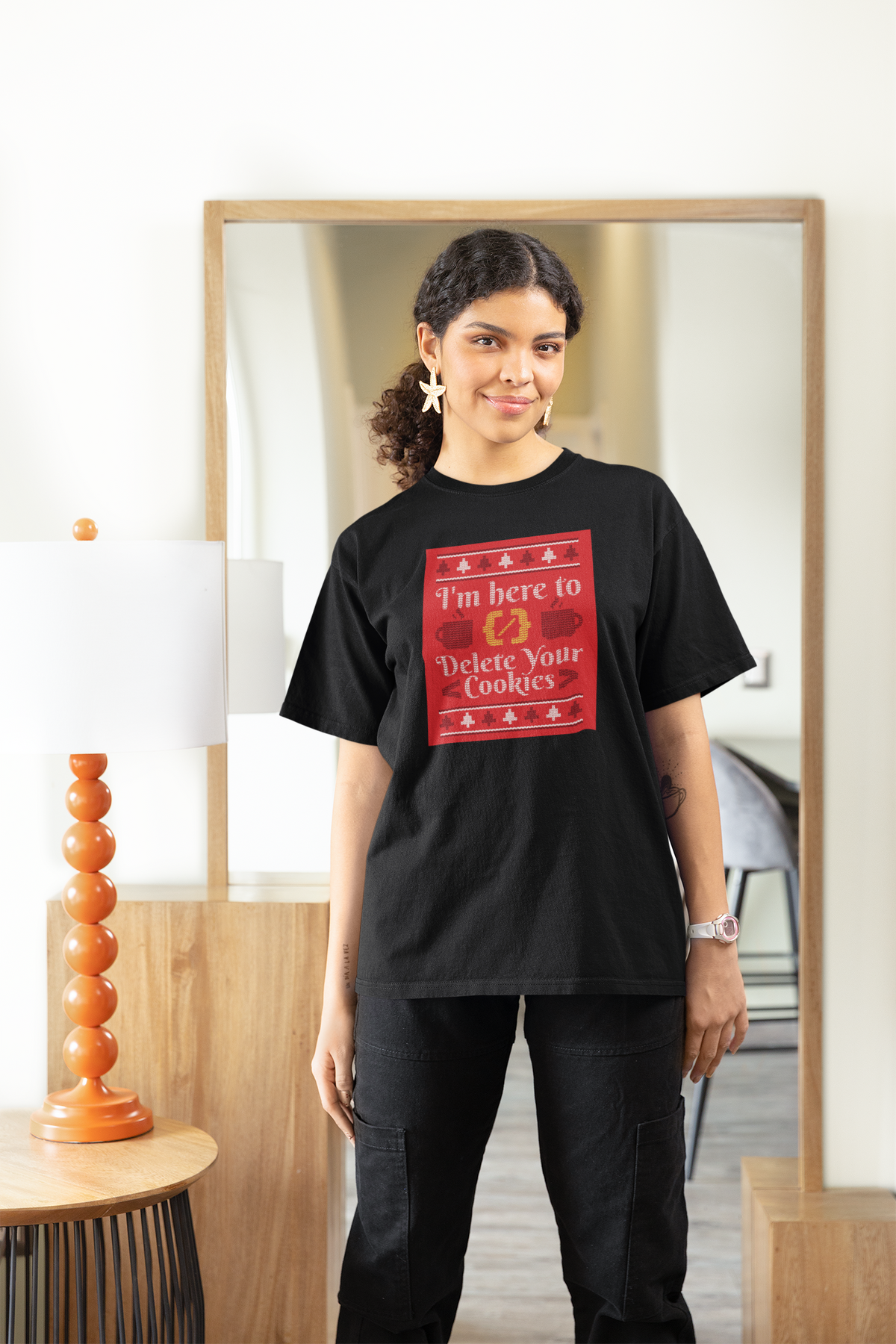 'I'm Here to Delete Your Cookies' Women's T-Shirt in black, woman wearing it at home, programmer gift