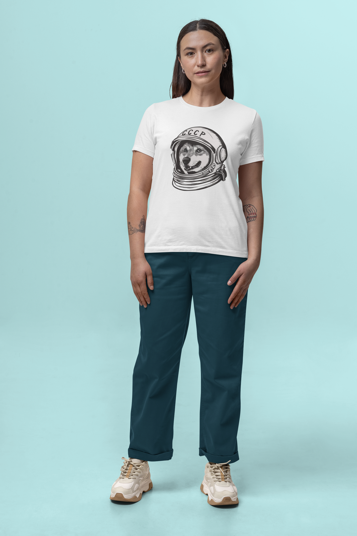 'CCCP Astronaut Dog' t-shirt in white, woman wearing it in a stylish room, funny gift idea