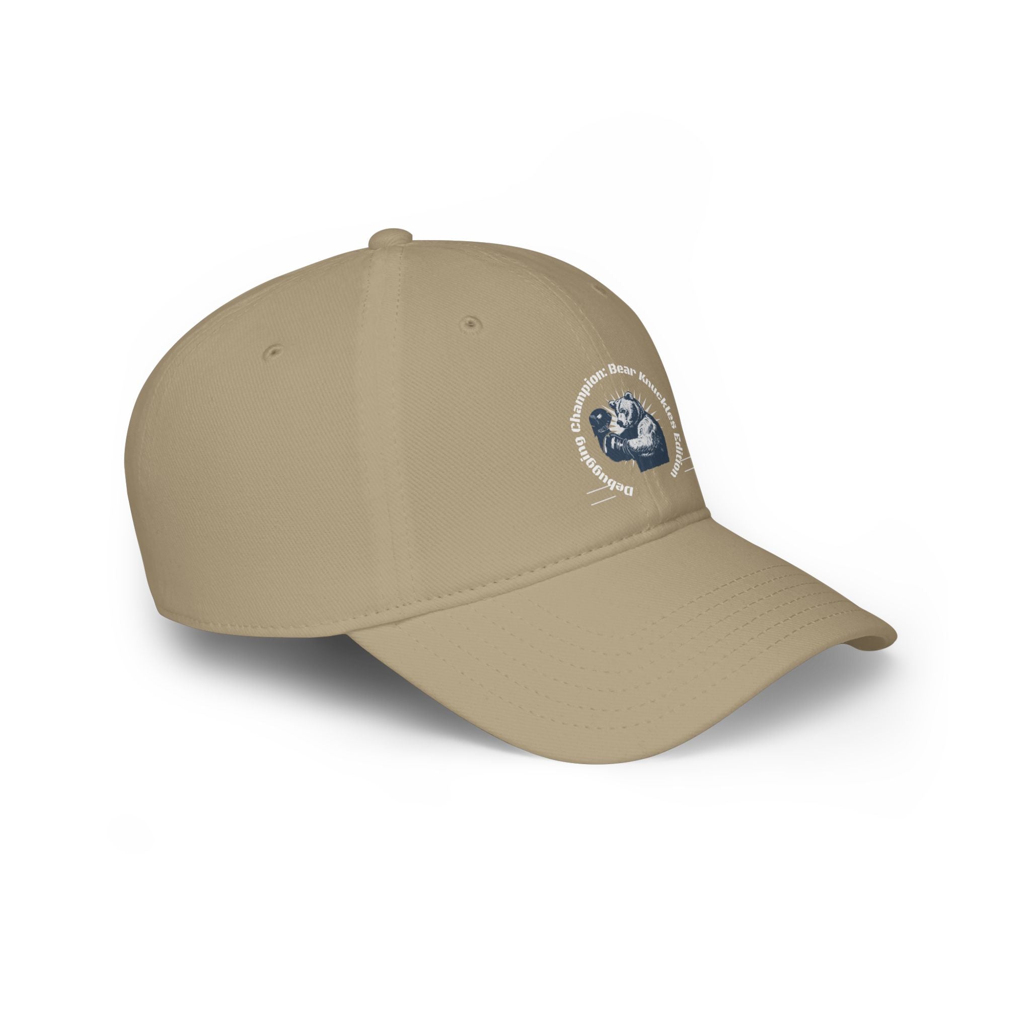 The Debugging Champion - Hat is a beige baseball cap with a blue and white embroidered logo on the side, featuring a stylized image and text. It's perfect for showcasing your coder prowess. This hat also features a curved brim, vent holes on top, and reinforced stitching for added durability.