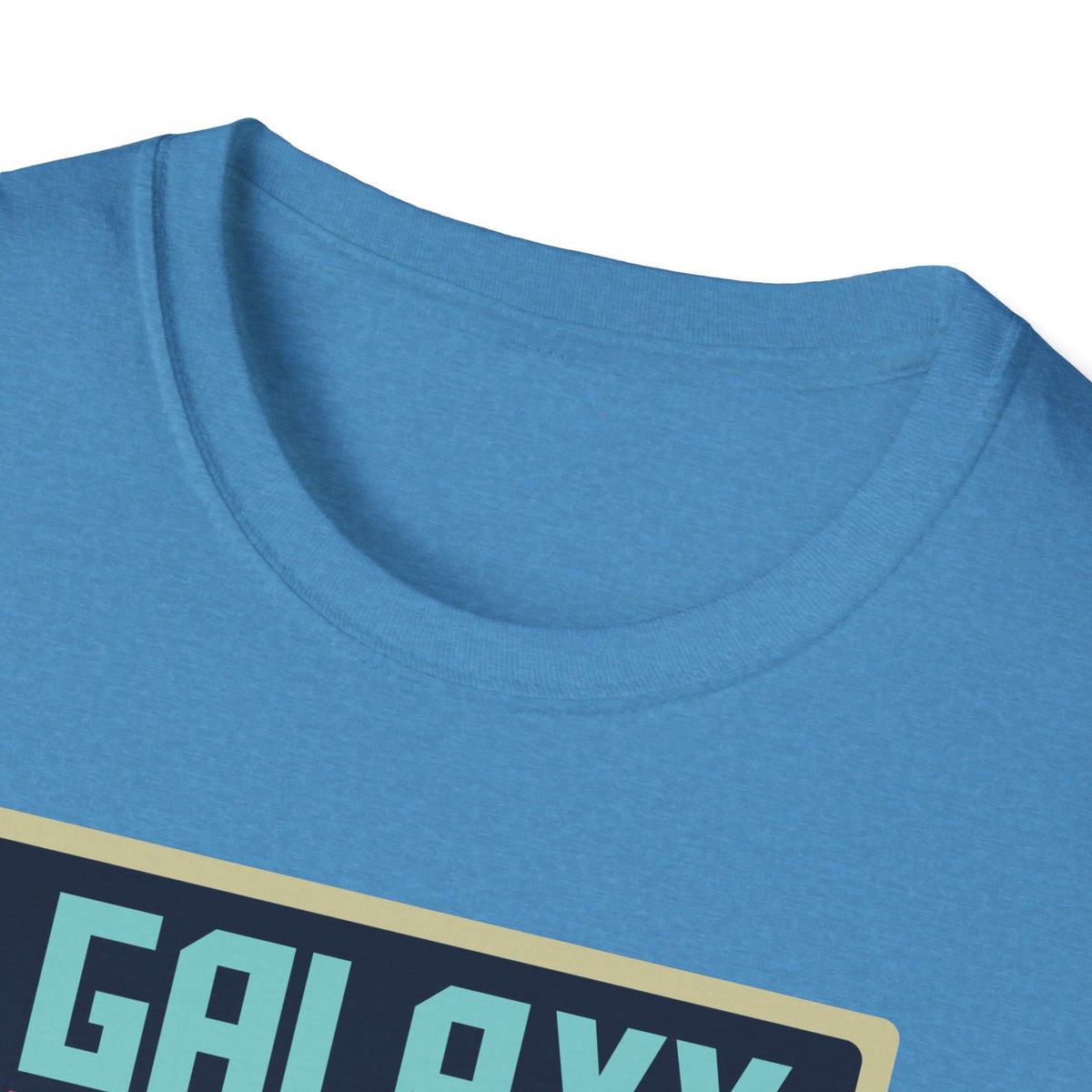 Close-up of "Galaxy Invaders" teal text print on denim blue t-shirt collar, retro arcade detail