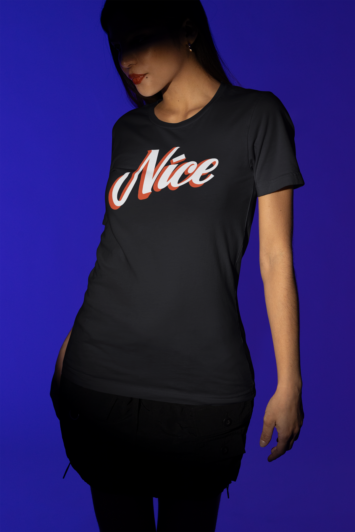 Nice script tee in black, woman wearing it under dramatic blue lighting, funny sarcastic humor shirt