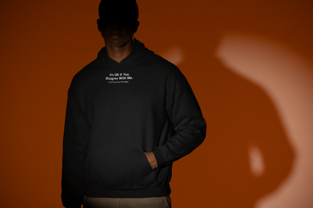 'It's Ok If You Disagree Hoodie' in black, man under a spotlight, Hoodie mockup, Geekpsters