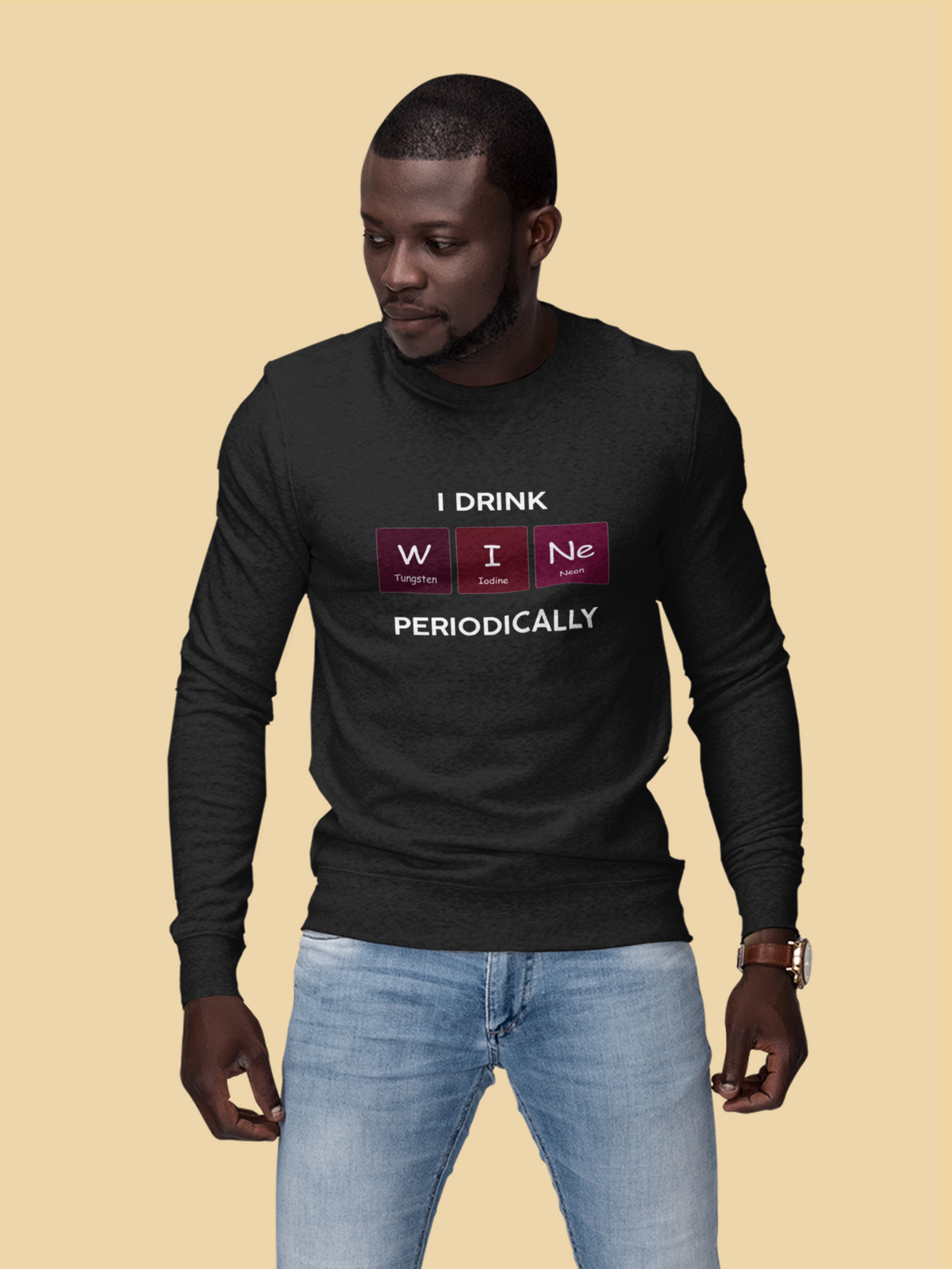'I Drink Wine Periodically' periodic table sweatshirt in black, man wearing it against a tan backdrop, funny wine gift