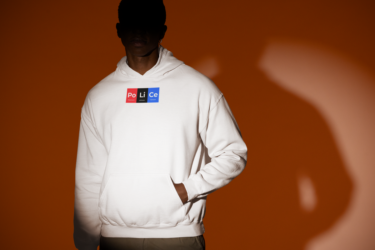 'Po-Li-Ce Periodic Table Hoodie' in white, man under a spotlight, Hoodie mockup, Geekpsters