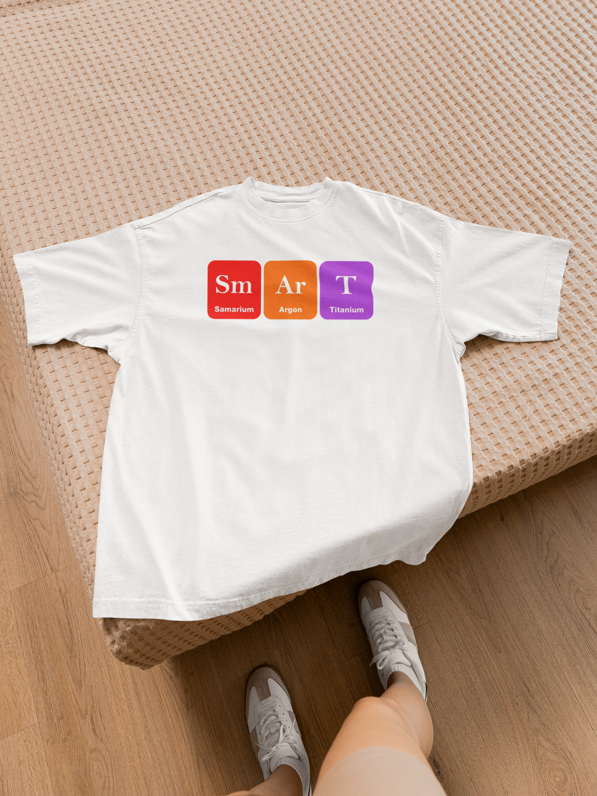 'Smart' periodic table t-shirt in white, flat lay on floor with sneakers, funny science pun gift