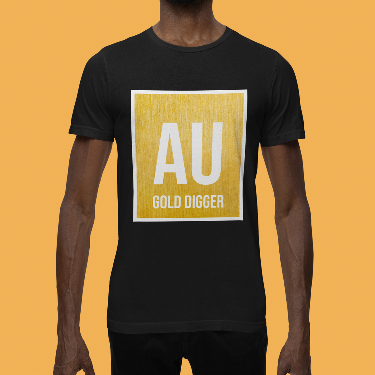 'AU Gold Digger' graphic t-shirt in black, man wearing it against orange backdrop, funny science pun shirt