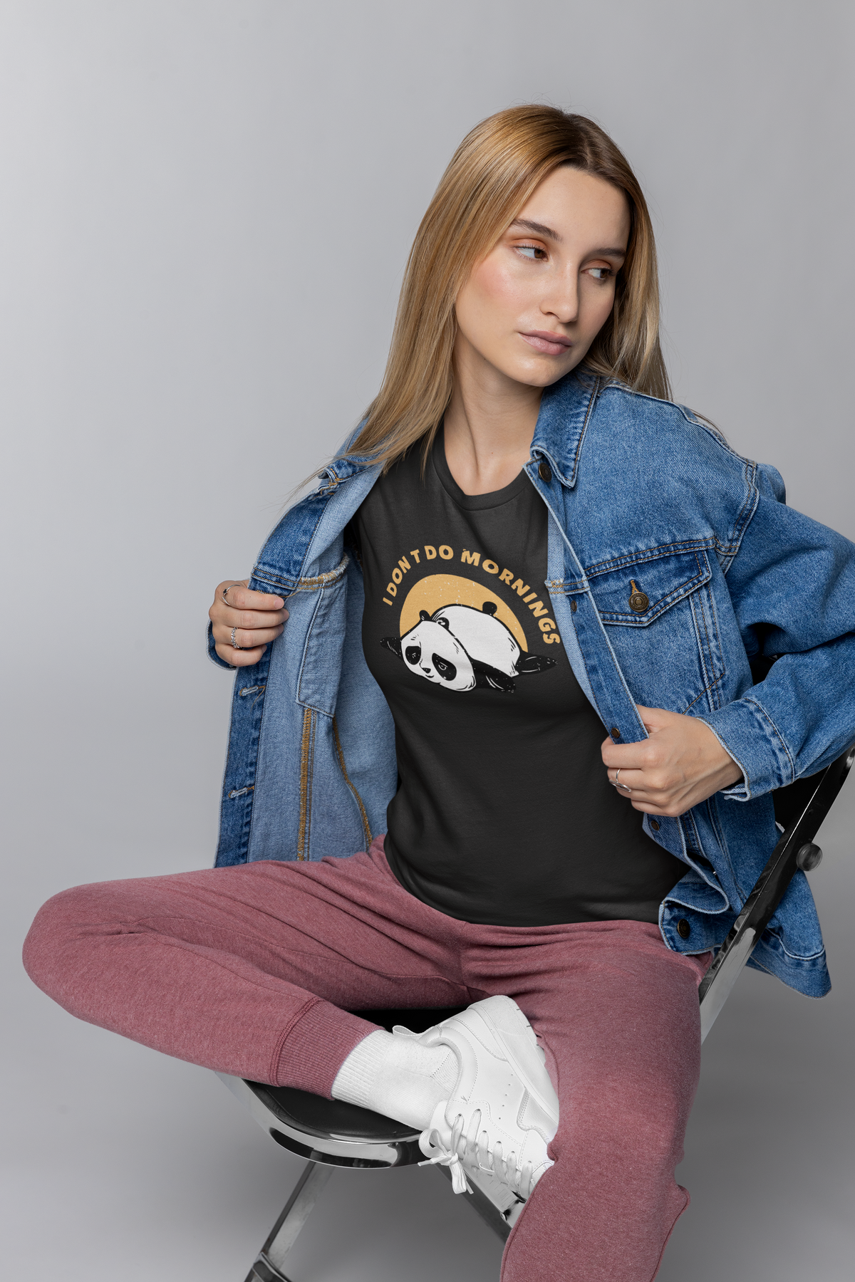 'I Don't Do Mornings' panda t-shirt in black, woman wearing it with denim jacket, funny sunrise gift