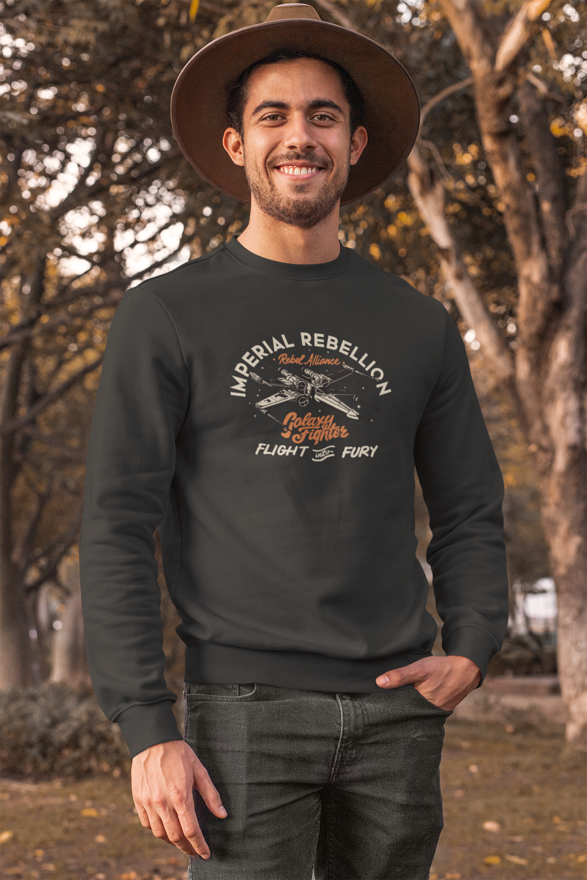"Imperial Rebellion" fighter jet sweatshirt in dark grey, man in a hat wearing it outdoors, Star Wars fan gift