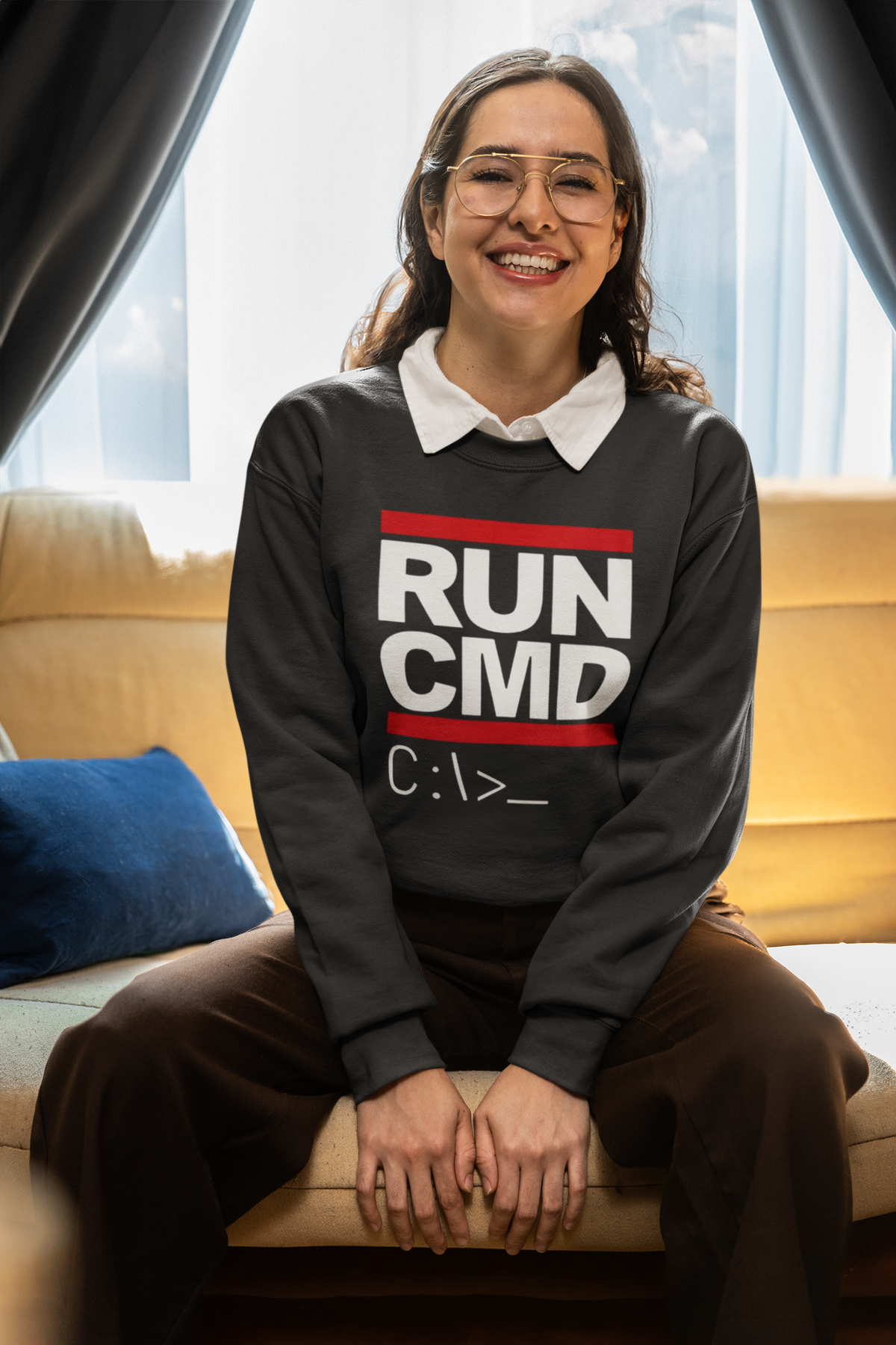 RUN CMD sweatshirt in black, woman wearing it seated indoors, funny coder pun gift