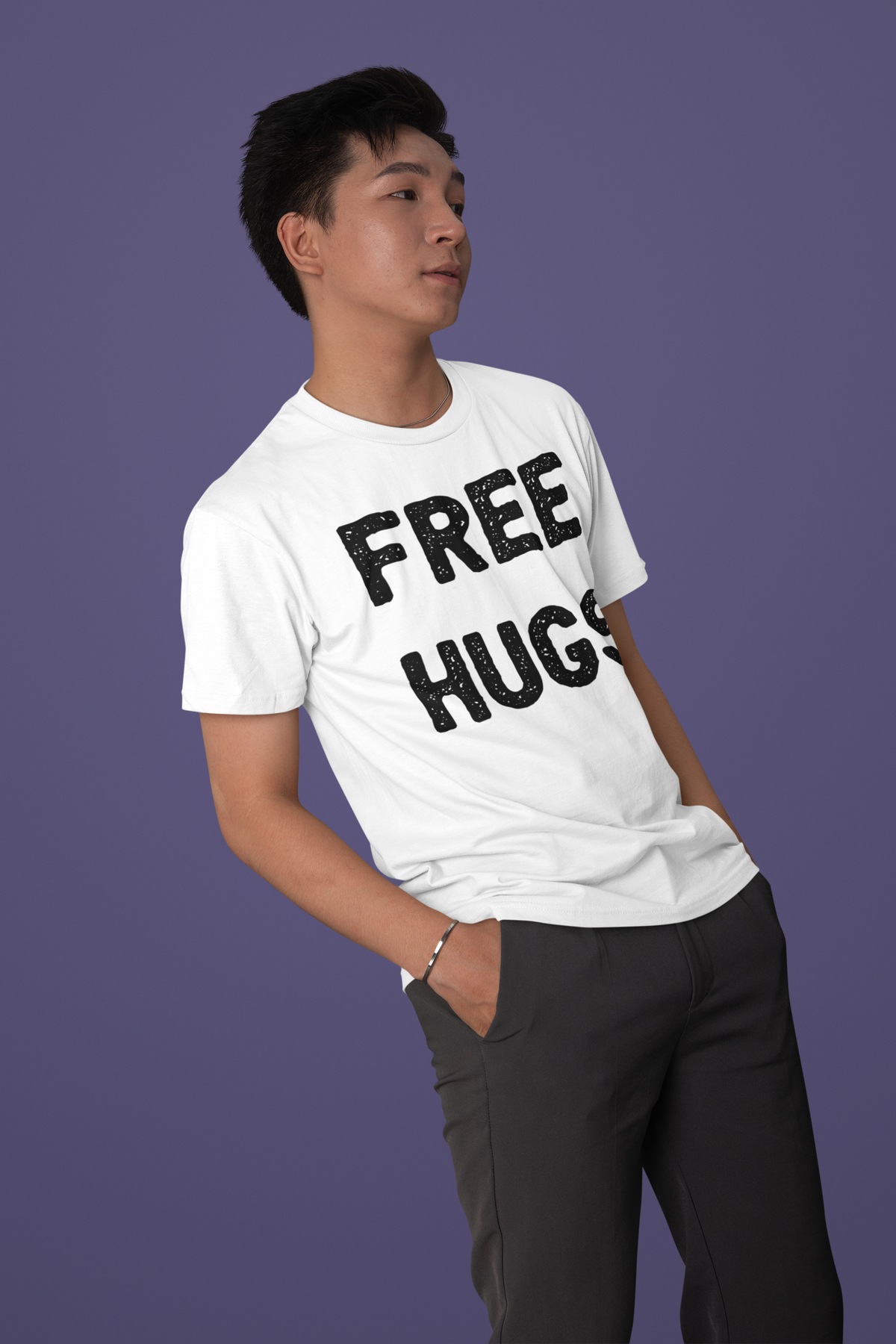 'Free Hugs' t-shirt in white, man wearing it on purple backdrop, funny sarcastic shirt gift