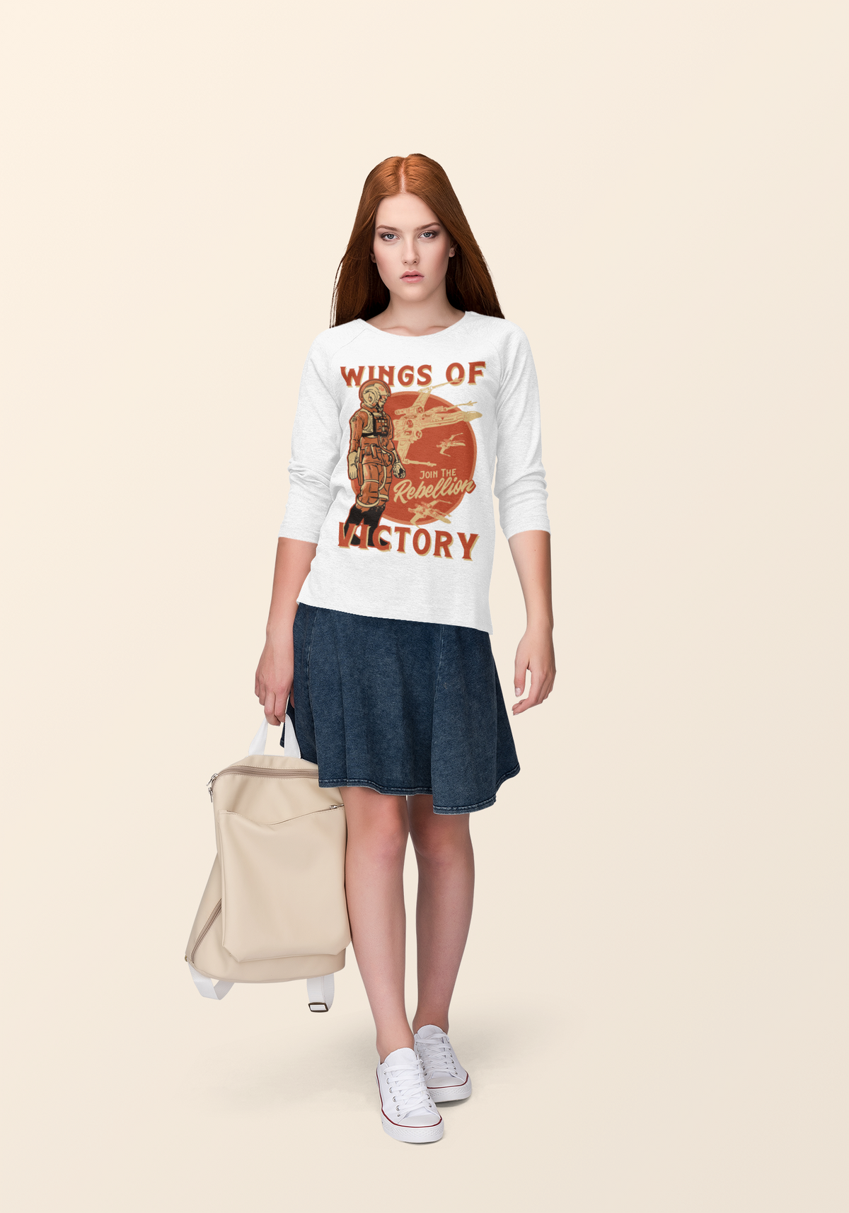 'Wings of Victory' sweatshirt in white, woman wearing it with skirt, lifestyle rebel warrior sweatshirt