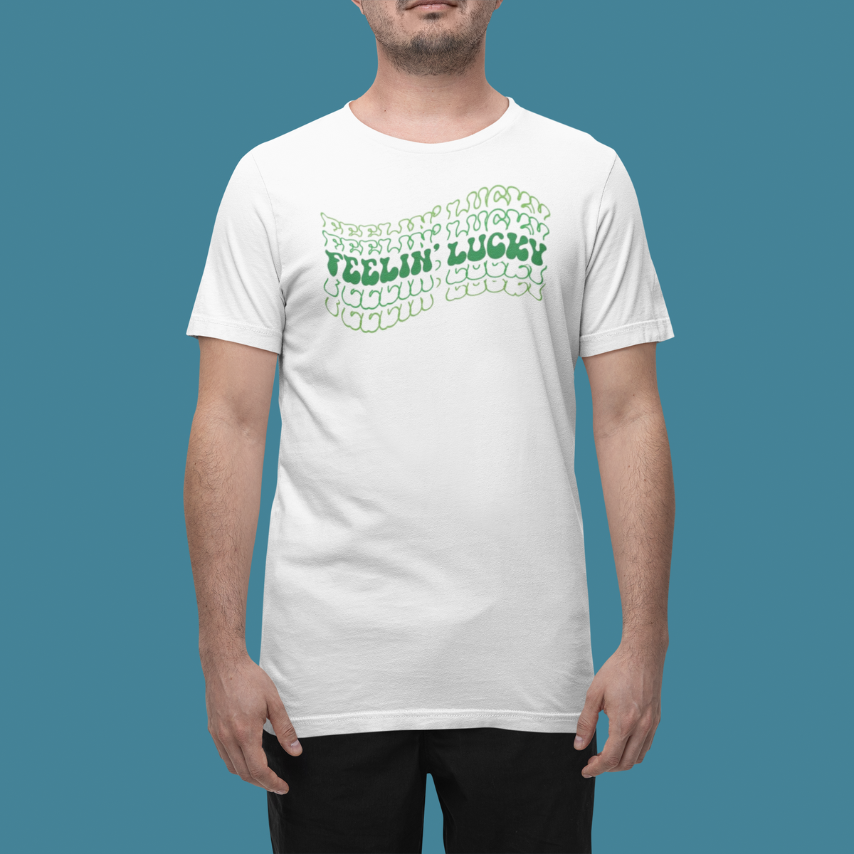'Feeling Lucky' t-shirt in white, man wearing it in a studio, T-Shirt mockup, Geekpsters