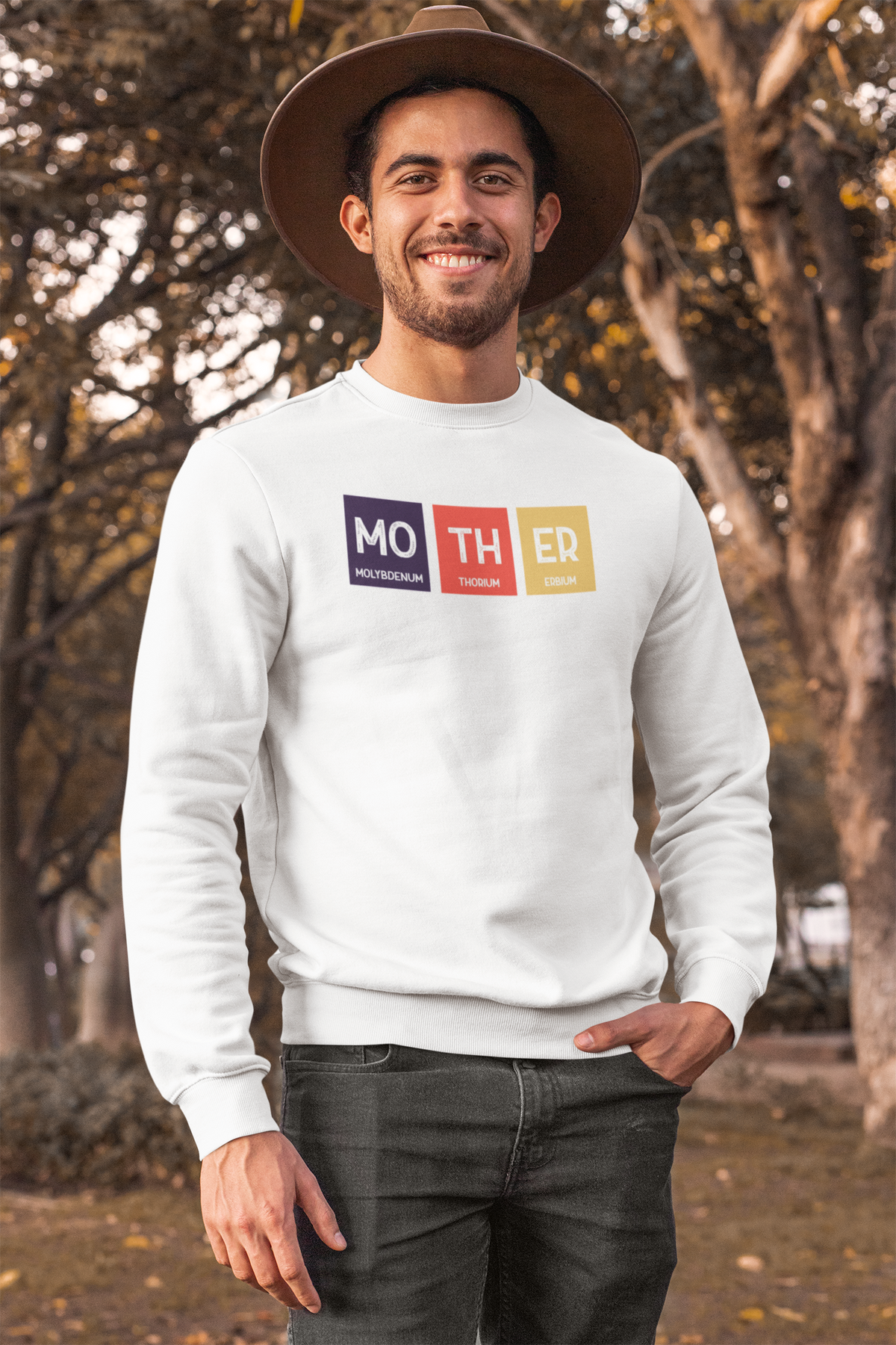 'Mo-TH-ER' periodic table sweatshirt in white, man wearing it outdoors, funny science pun gift
