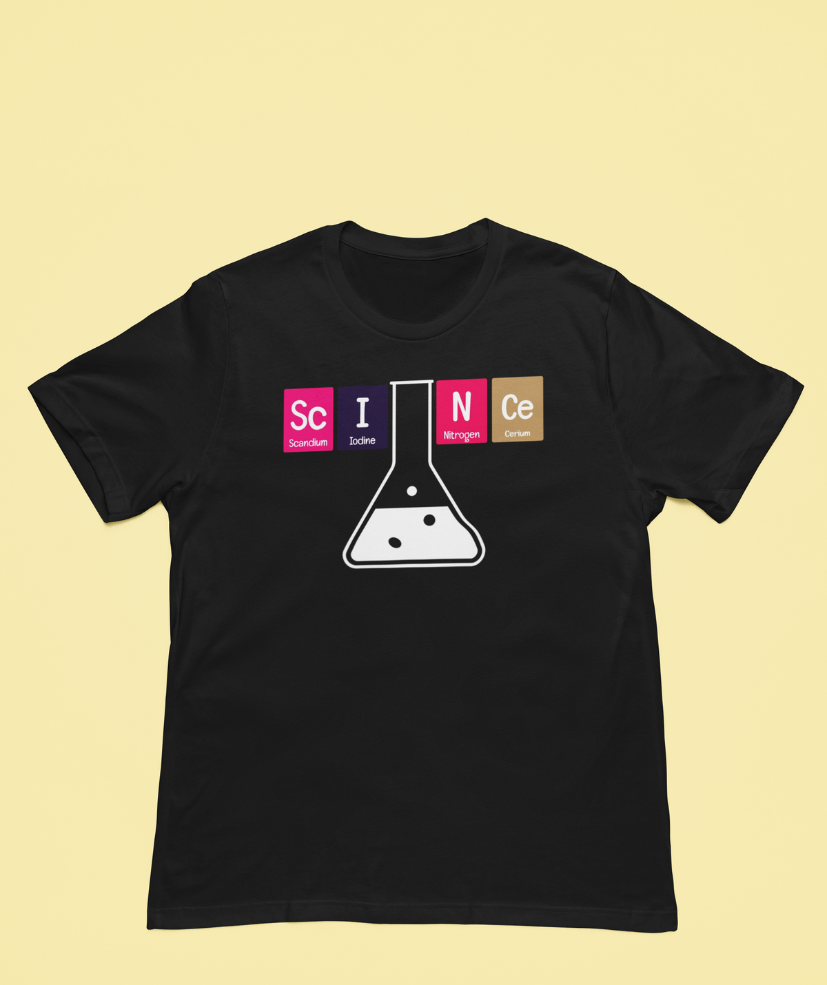 'Science' periodic table t-shirt in black with flask graphic, flat lay on yellow backdrop, chemistry teacher gift
