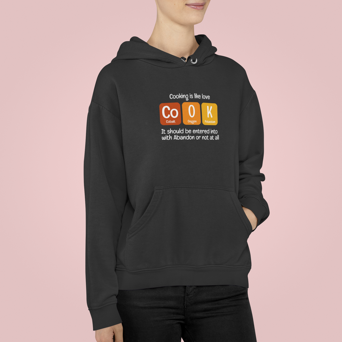 Co-O-K periodic table cook element pun pullover hoodie, lifestyle shot with the design in focus