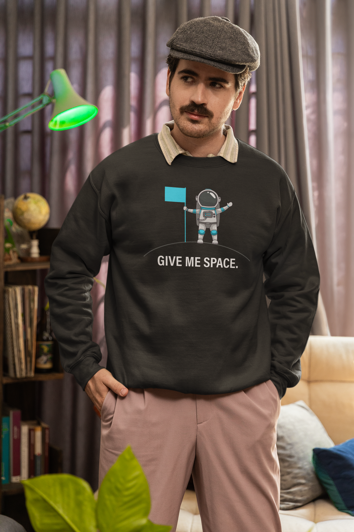 Give Me Space Sweatshirt in charcoal, man in a flat cap wearing it indoors, funny introvert gift